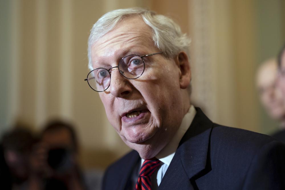 Senate Minority Leader Mitch McConnell, R-Ky., speaks with reporters at the Capitol in Washington, May 24. A gunman suspected of fatally shooting a retired county judge at a Wisconsin home had a list of targets that included Michigan Gov. Gretchen Whitmer, McConnell and Wisconsin Gov. Tony Evers, Whitmer's office and a law enforcement source said Saturday.
