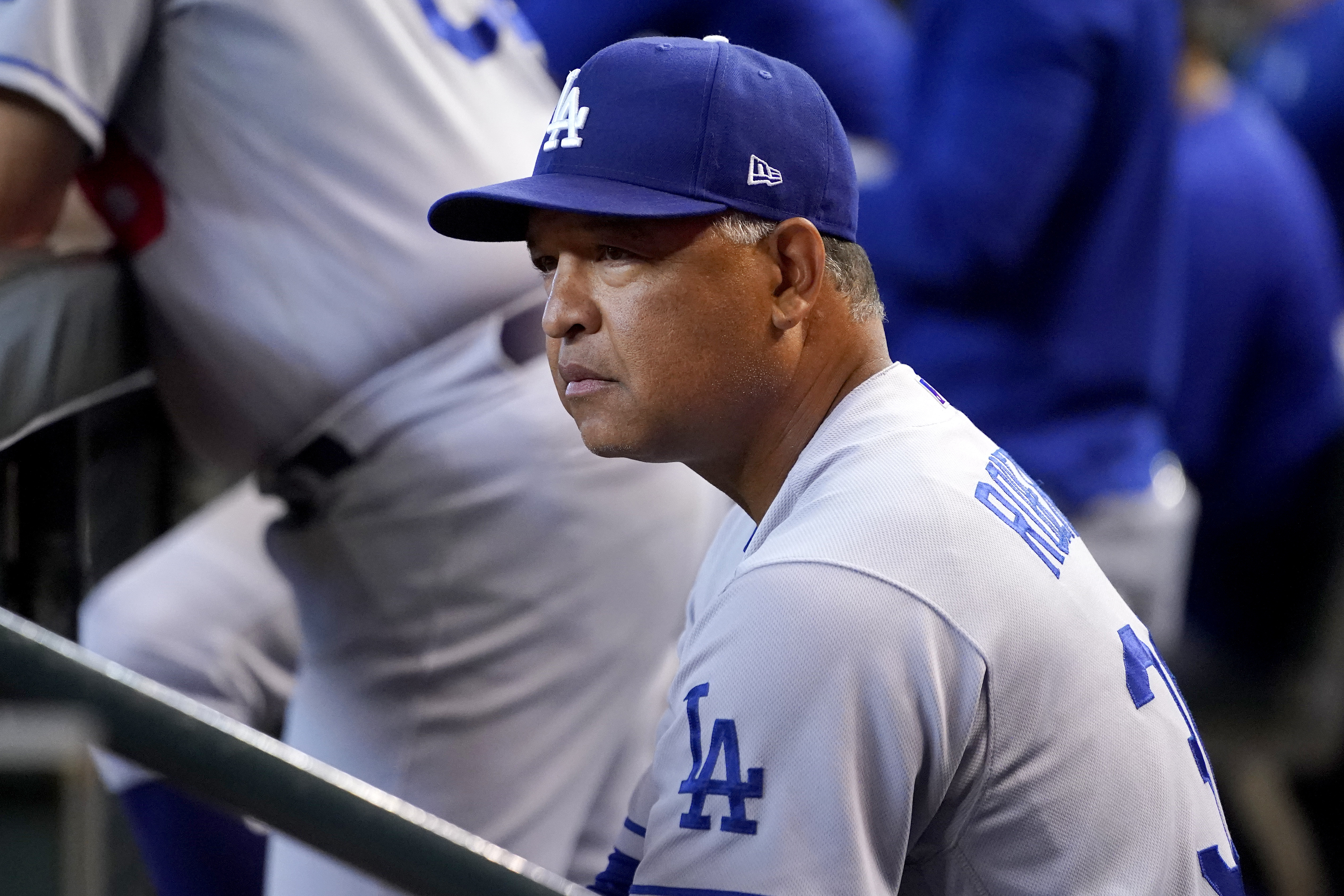 Los Angeles Dodgers manager Dave Roberts watches play during the second inning of a baseball game against the Arizona Diamondbacks, Saturday, May 28, 2022, in Phoenix. 