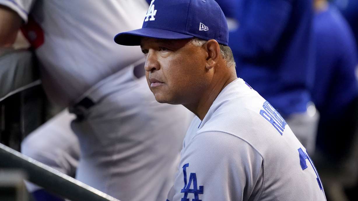 Los Angeles Dodgers manager Dave Roberts watches play during the second inning of a baseball game against the Arizona Diamondbacks, Saturday, May 28, 2022, in Phoenix.