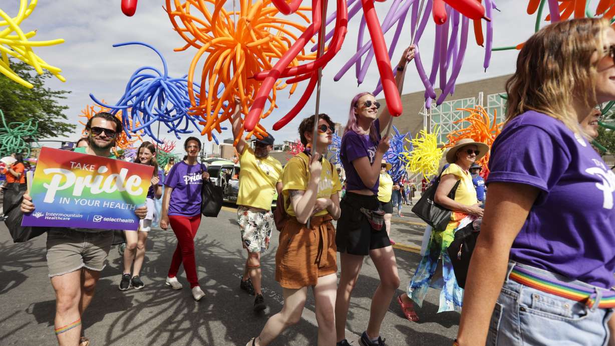 Intermountain Healthcare employees march during the Utah Pride parade along 200 South in Salt Lake City on Sunday.