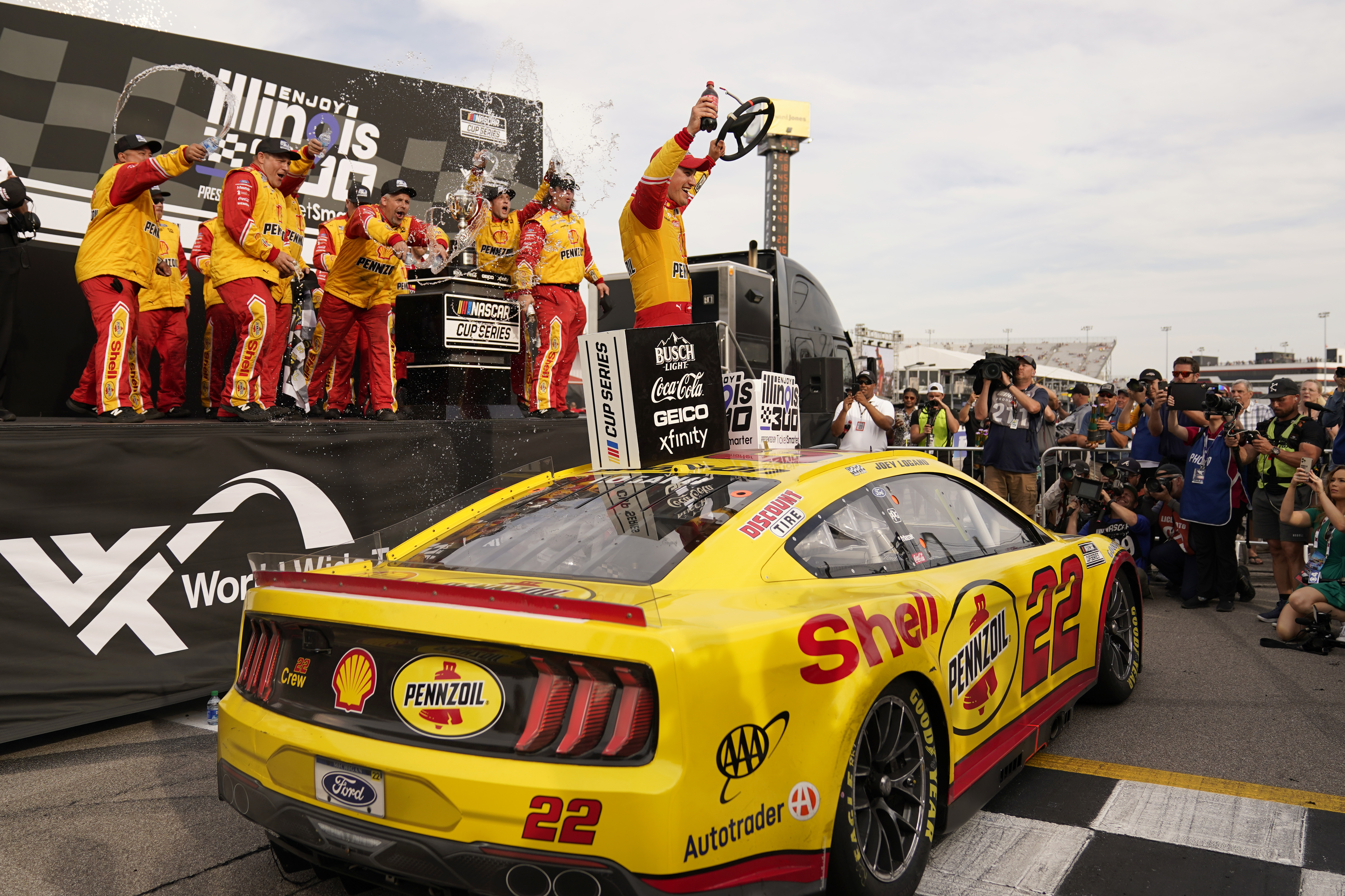 Joey Logano celebrates after winning a NASCAR Cup Series auto race at World Wide Technology Raceway, Sunday, June 5, 2022, in Madison, Ill. 