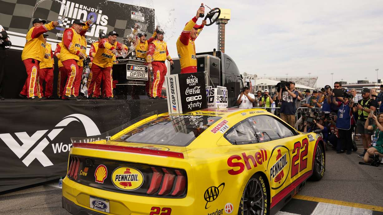 Joey Logano celebrates after winning a NASCAR Cup Series auto race at World Wide Technology Raceway, Sunday, June 5, 2022, in Madison, Ill.