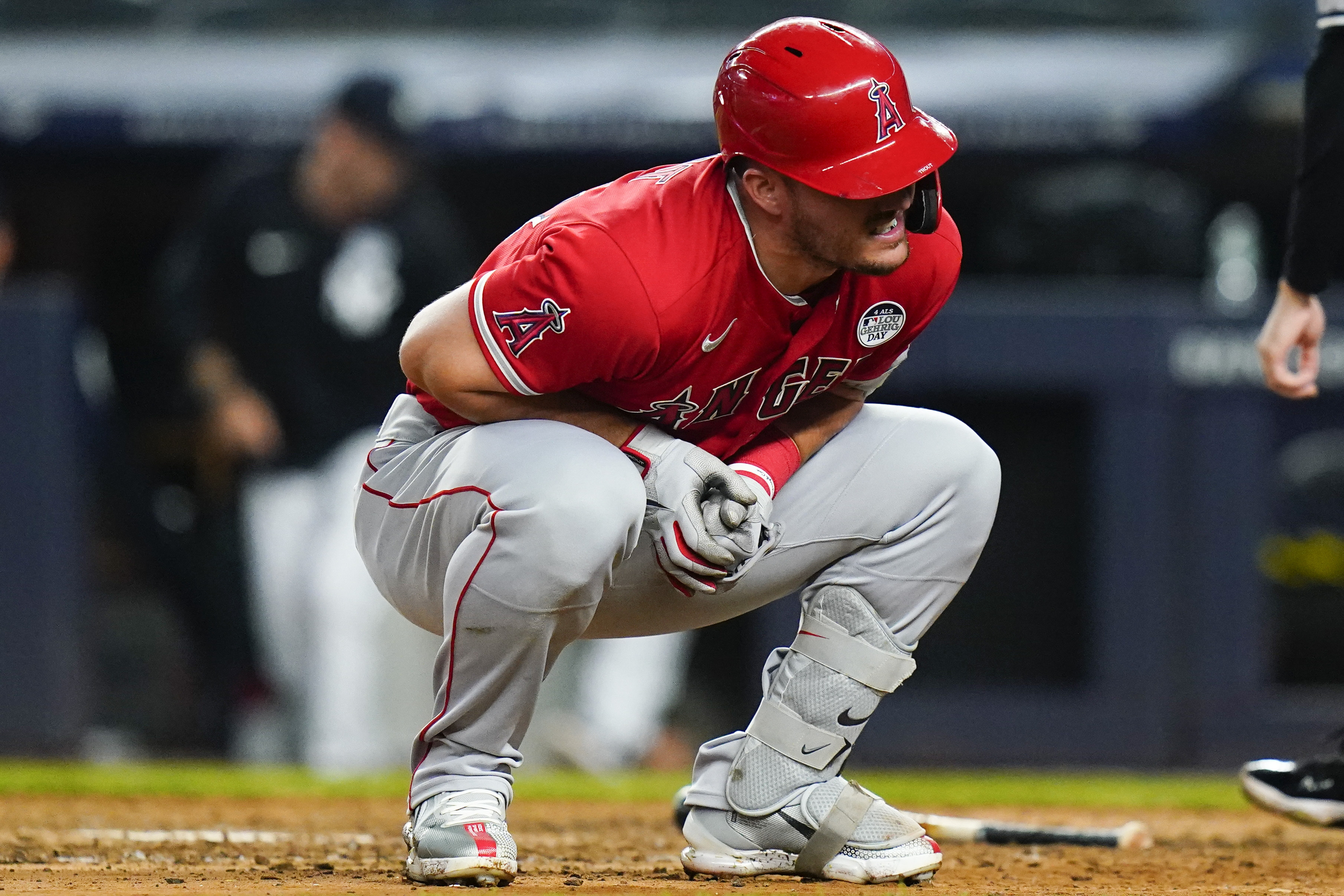 Los Angeles Angels' Mike Trout reacts after he was hit by a pitch during the ninth inning in the second baseball game of a doubleheader against the New York Yankees, Thursday, June 2, 2022, in New York. 