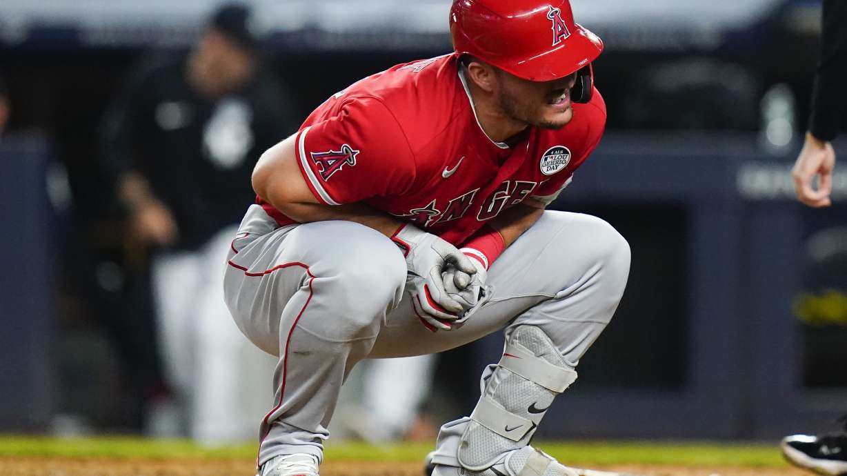 Los Angeles Angels' Mike Trout reacts after he was hit by a pitch during the ninth inning in the second baseball game of a doubleheader against the New York Yankees, Thursday, June 2, 2022, in New York.