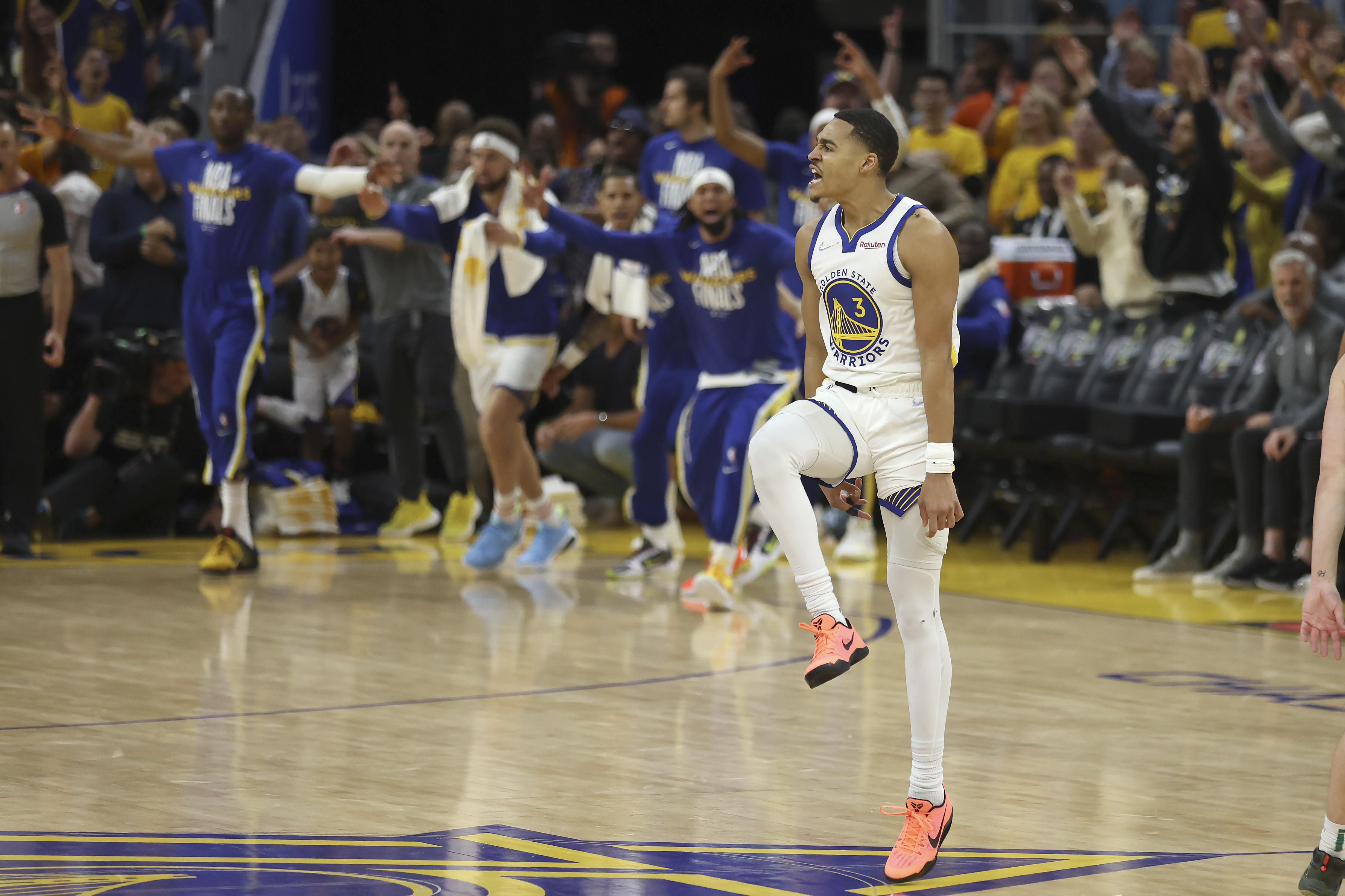 CORRECTS TO GAME 2 INSTEAD OF GAME 1 - Golden State Warriors guard Jordan Poole (3) celebrates after scoring against the Boston Celtics during the second half of Game 2 of basketball's NBA Finals in San Francisco, Sunday, June 5, 2022.