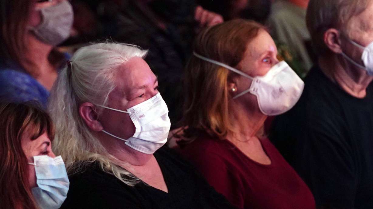 Audience members wear masks during “An Evening with LeAnn Rimes,” on May 31, at the GRAMMY Museum in Los Angeles. Alameda County in the San Francisco Bay Area has reinstated a mask mandate after hitting a high community level for COVID-19, and Los Angeles County could do the same by the end of the month.