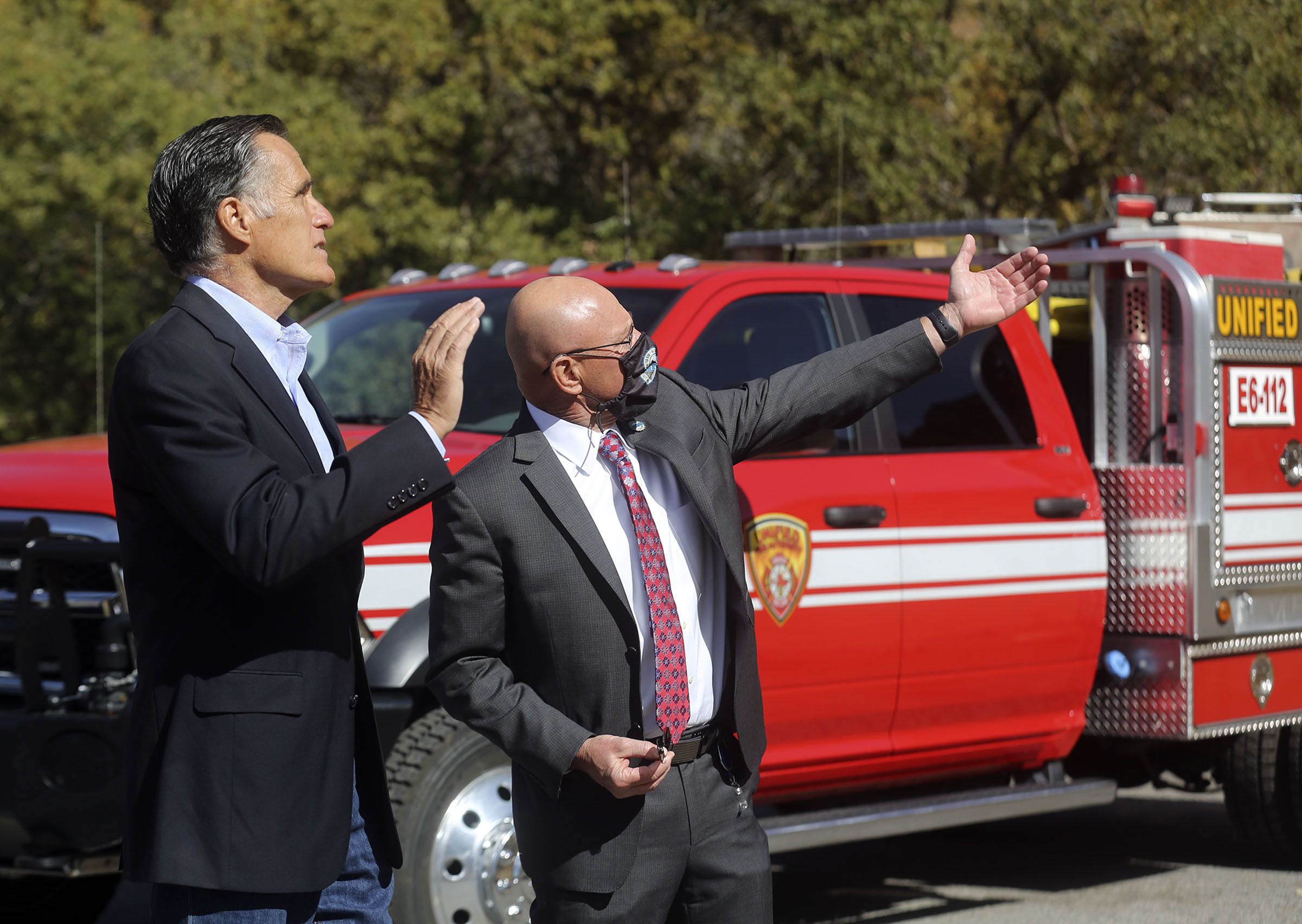 Sen. Mitt Romney, R-Utah, speaks to Millcreek Mayor Jeff Silvestrini at the Neff’s Canyon trailhead in Millcreek on Oct. 15, 2020. Romney has reached the halfway mark in his Senate term. He released a report Monday outlining what he says he has accomplished for Utah and the country the past three years.