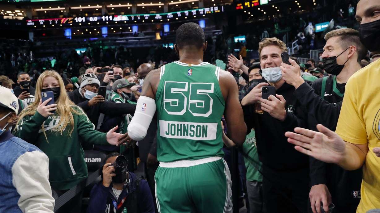 FILE - Boston Celtics' Joe Johnson is cheered by fans as he leaves the court after their win over the Cleveland Cavaliers in an NBA basketball game, Wednesday, Dec. 22, 2021, in Boston. It could be argued the untold MVP's of this season were the more than 100 players signed to short-term hardship contracts to fill in when almost every team was decimated by the Omicron variant and other virus issues in December and January.