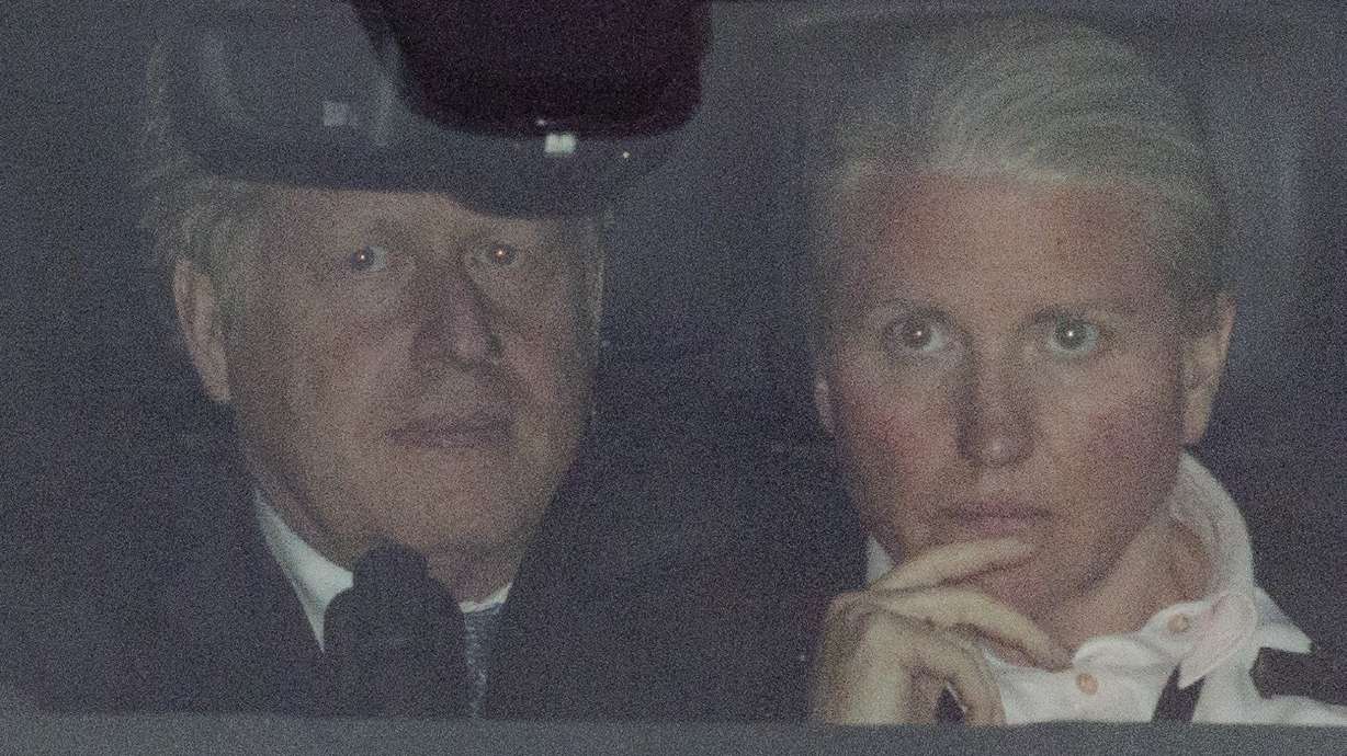 British Prime Minister Boris Johnson leaves the Houses of Parliament, in London, Monday. Johnson faced a no-confidence vote Monday night that could oust him from power, as discontent with his rule finally threatens to topple a politician who has often seemed invincible despite many scandals.