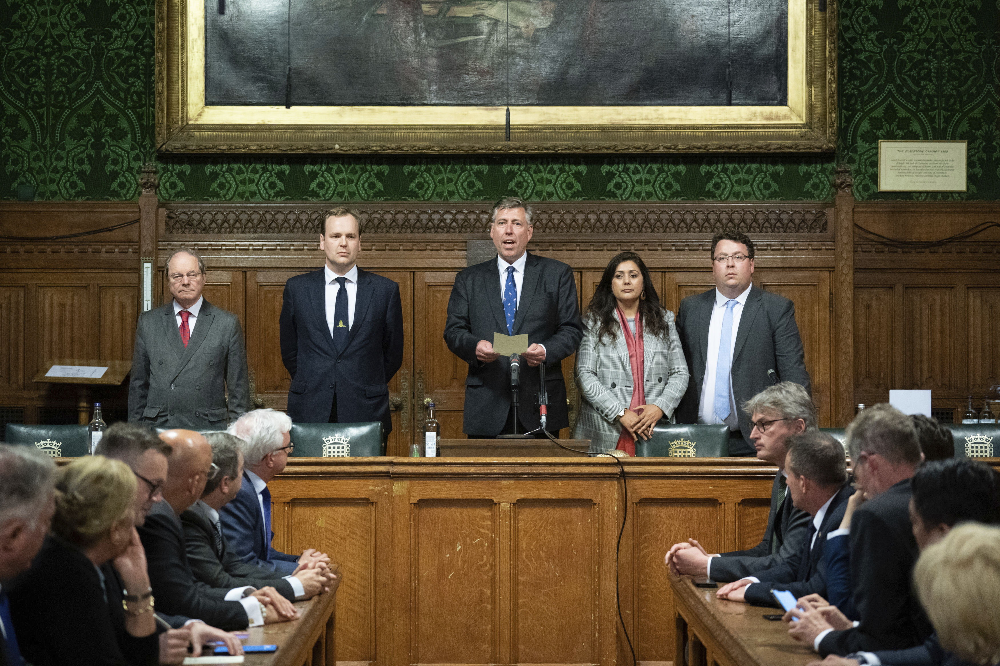 Sir Graham Brady, Chairman of the 1922 Committee of Conservative backbenchers, announces that Britain's Prime Minister Boris Johnson has survived an attempt by Tory MPs to oust him as party leader following a confidence vote in his leadership at the Houses of Parliament, in London, Monday.