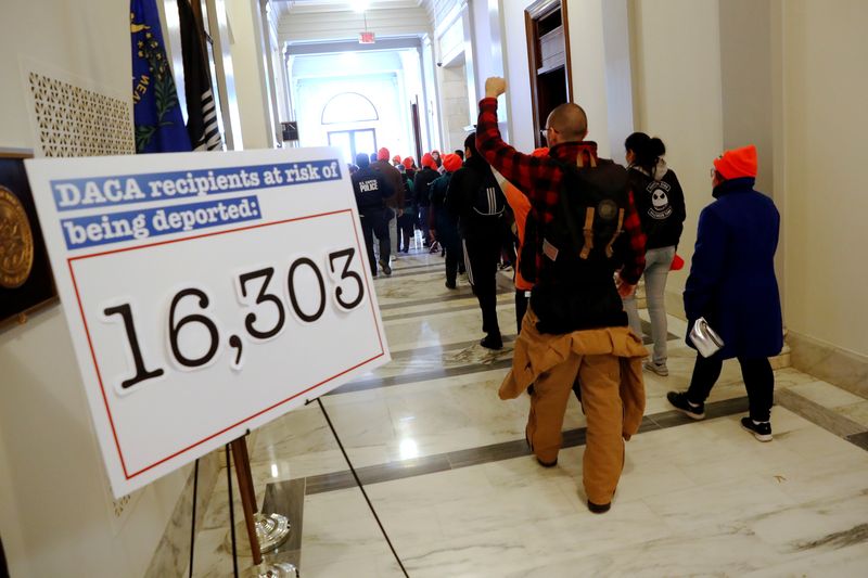 Demonstrators calling for new protections for so-called "Dreamers," undocumented children brought to the U.S. by their immigrant parents, walk through a Senate office building on Capitol Hill in Washington, January 17, 2018.