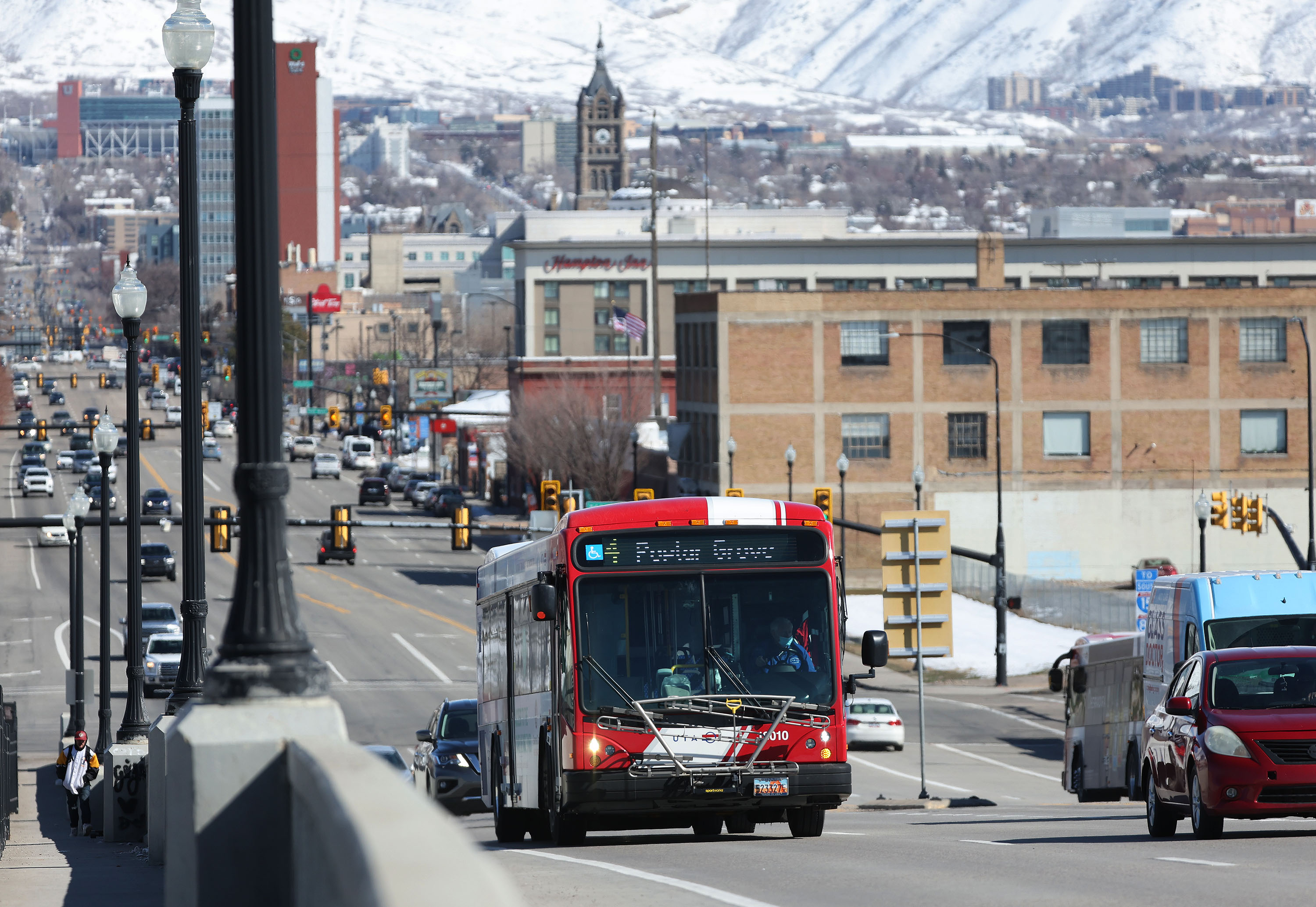 A UTA bus travels on 400 South in Salt Lake City on March 10. UTA is planning on cutting 22 routes across its service range in August, while altering routes to cover service areas.