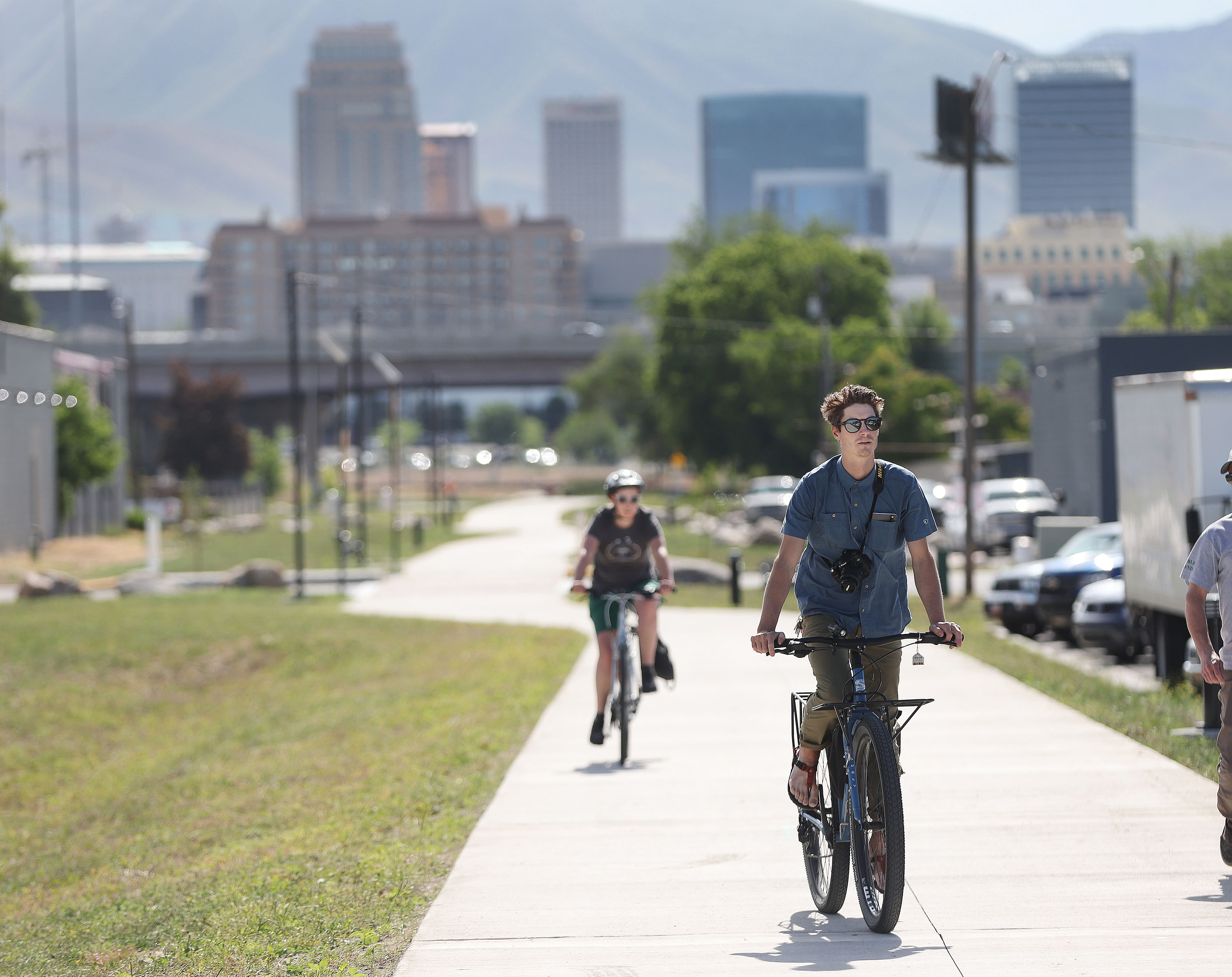 Brian Tonetti and Evelyn Lamb ride on the Folsom Trail in Salt Lake City on Tuesday. The Utah Transit Authority, Salt Lake City and the Federal Transit Administration have completed the first phase of the trail, a one-mile, paved, shared use pathway for walking and bicycling that connects west-side neighborhoods with UTA’s North Temple Station.