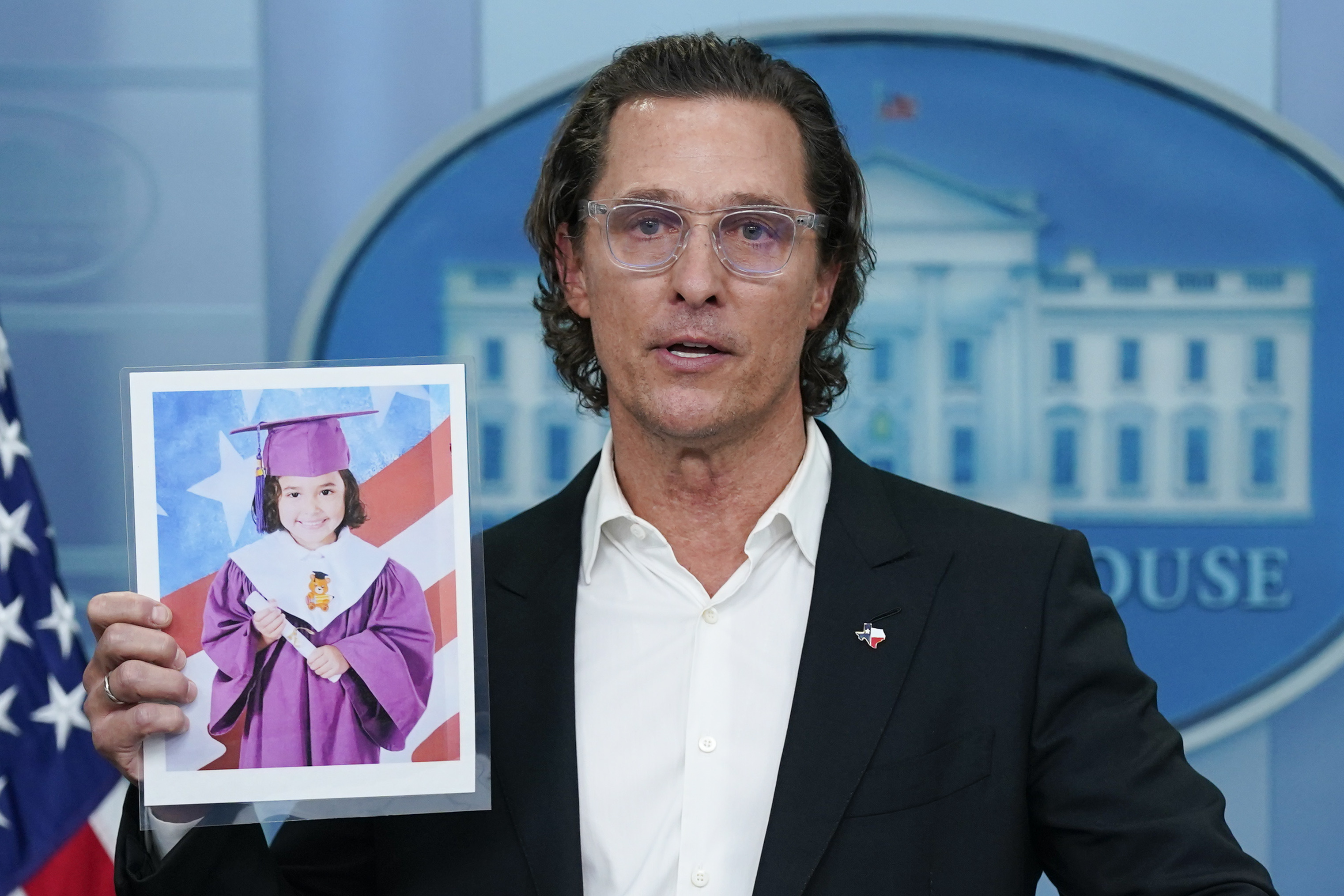 Actor Matthew McConaughey holds a picture of Alithia Ramirez, 10, who was killed in the mass shooting at an elementary school in Uvalde, Texas, as he speaks during a press briefing at the White House, Tuesday, in Washington. 