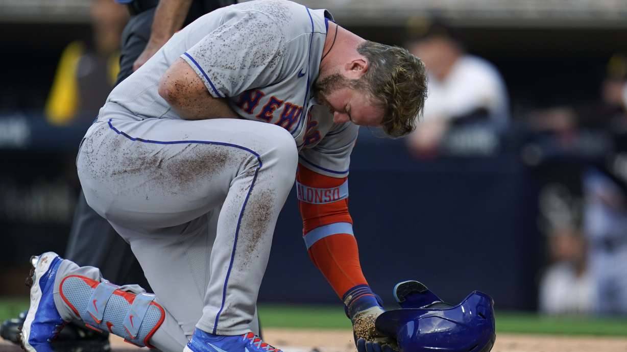 New York Mets' Pete Alonso reacts after being hit by a pitch while batting during the second inning of the team's baseball game against the San Diego Padres on Tuesday, June 7, 2022, in San Diego.