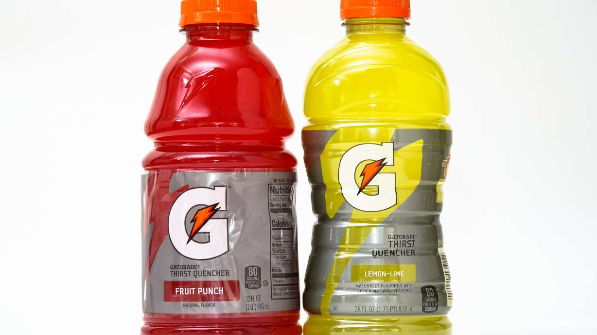 Bottles of Gatorade are pictured, left, a 32 fluid ounce and 28 fluid ounce, in Glenside, Pa., Monday. It's the inflation you're not supposed to see. From toilet paper to yogurt to corn chips, manufacturers are quietly shrinking package sizes without lowering prices. It's dubbed "shrinkflation," and it's accelerating worldwide.