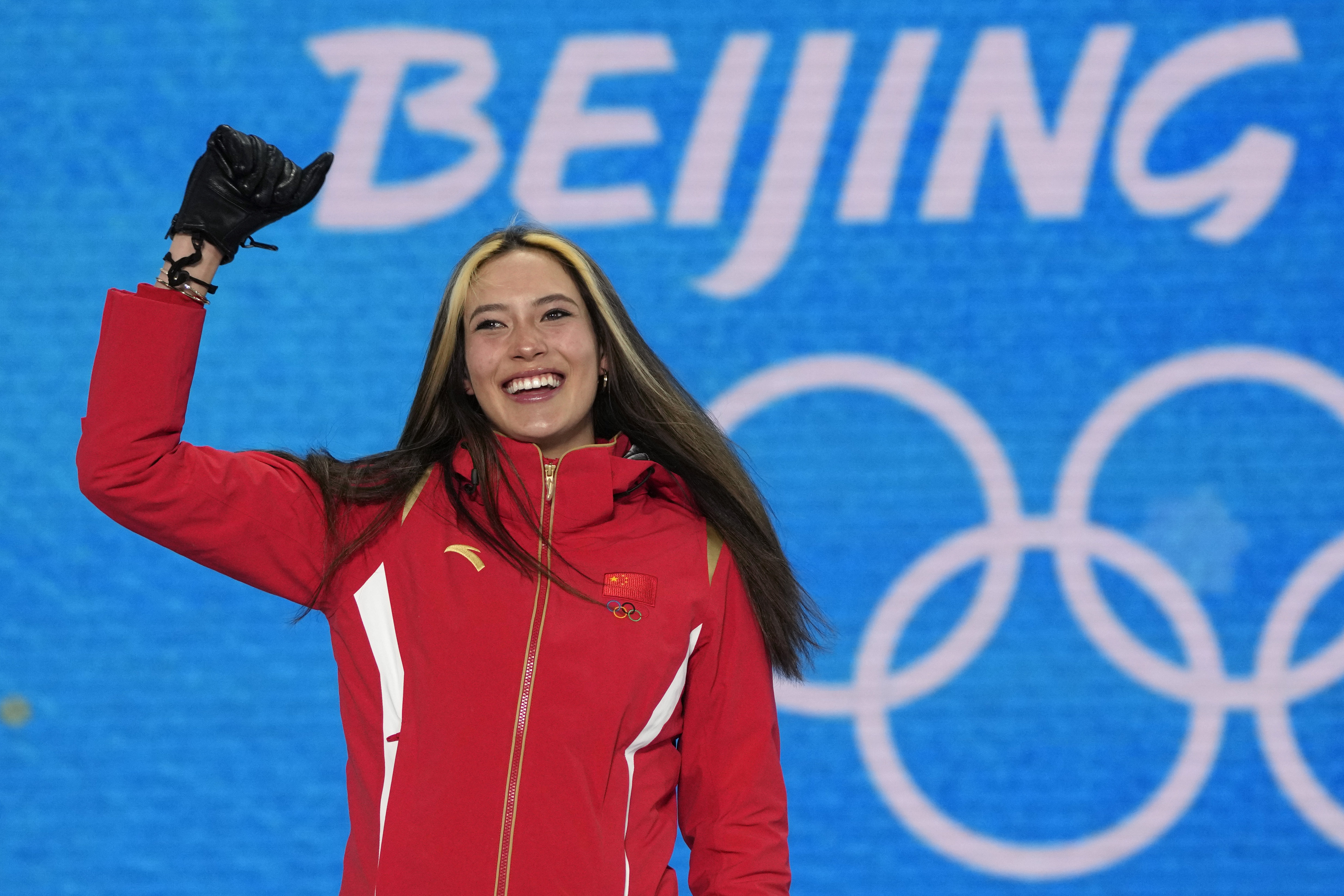 FILE - Gold medalist China's Eileen Gu celebrates during a medal ceremony for the women's freestyle skiing halfpipe competition at the 2022 Winter Olympics, Friday, Feb. 18, 2022, in Zhangjiakou, China. Gu, the California-born athlete who won two gold medals for China in freestyle skiing at the recent Beijing Olympics, has signed on to work for Salt Lake City's bid for the 2030 or 2034 Winter Olympics.