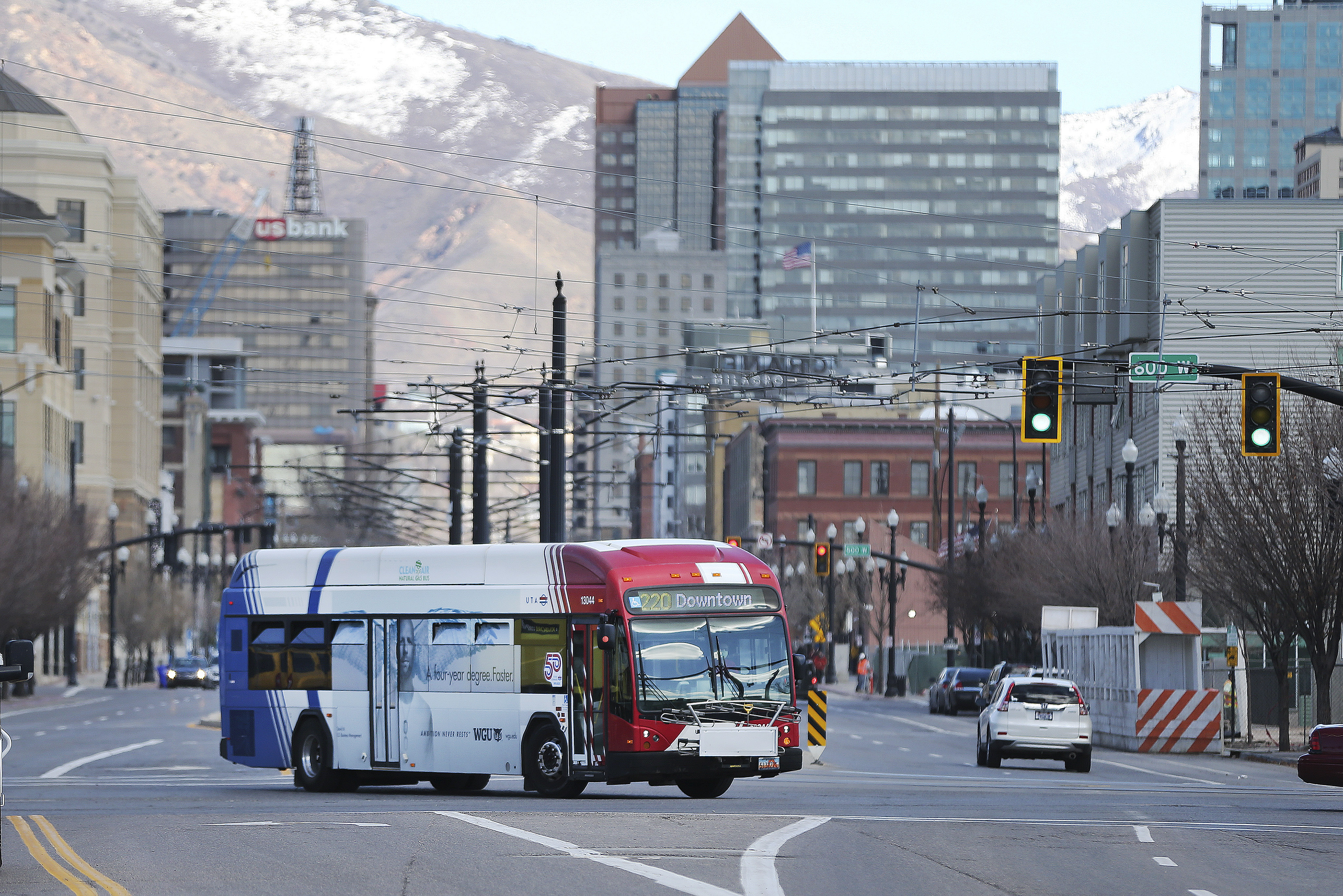 A Utah Transit Authority bus carries passengers in downtown Salt Lake City on Tuesday, Mar 17, 2020. UTA is on the verge of major service changes in August.