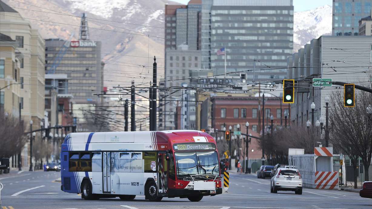 A Utah Transit Authority bus carries passengers in downtown Salt Lake City on Mar 17, 2020. Salt Lake City leaders said Thursday that they are likely to cut the city's Hive Pass program this year, but the city will likely maintain other programs with UTA.
