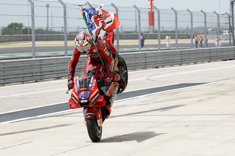 FILE PHOTO: Apr 10, 2022; Austin, Texas, USA; Jack Miller of Australia (43) performs a wheelie as he celebrates his third place finish in the MotoGP race at the Red Bull Grand Prix of the Americas MotoGP at Circuit of the Americas.
