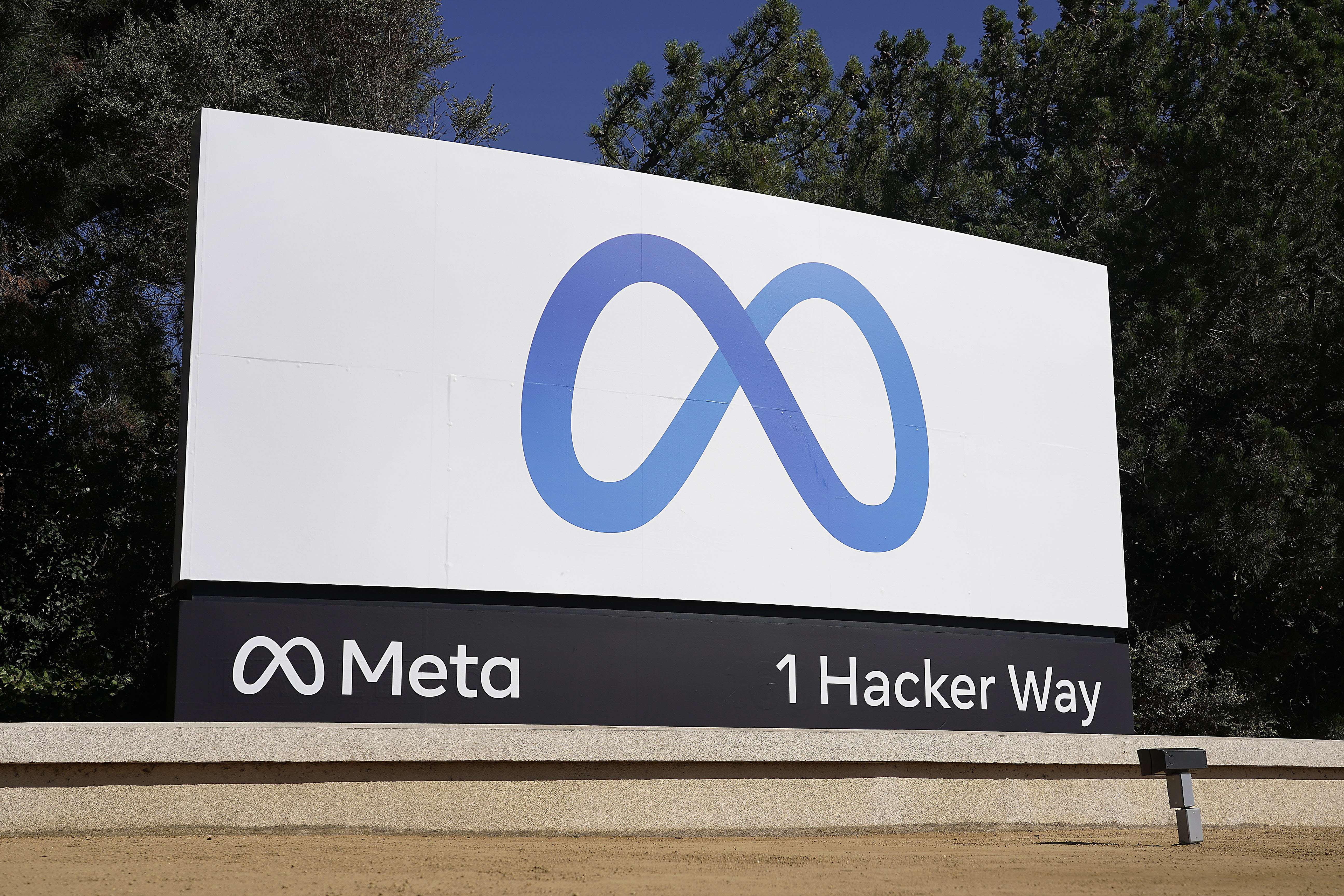 Facebook's Meta logo sign is seen at the company headquarters in Menlo Park, Calif. on Oct. 28, 2021. According to a report released Thursday, Facebook and parent company Meta once again failed to detect blatant, violent hate speech in advertisements submitted to the platform by the nonprofit groups Global Witness and Foxglove. 
