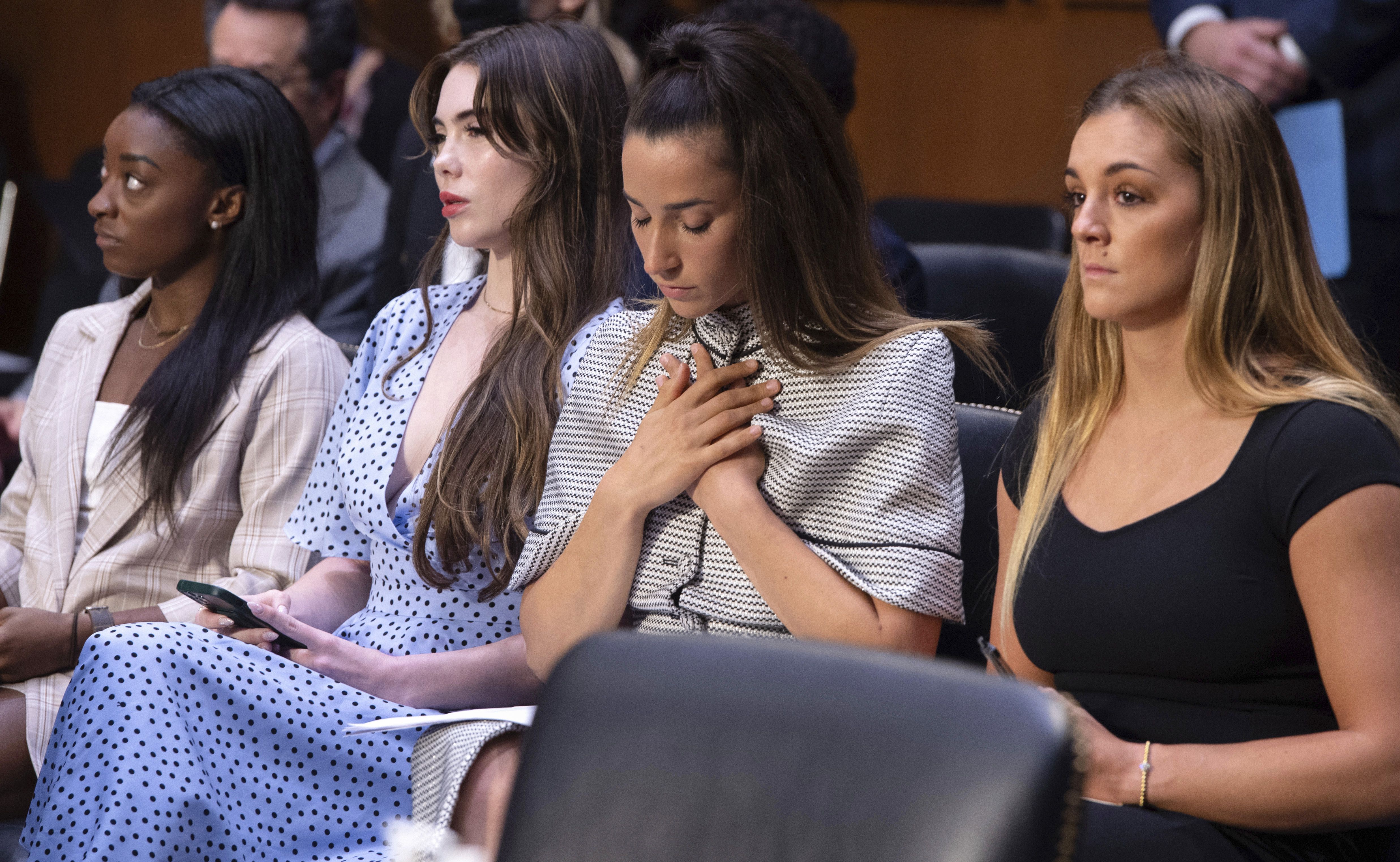 United States gymnasts from left, Simone Biles, McKayla Maroney, Aly Raisman and Maggie Nichols, arrive to testify during a Senate Judiciary hearing about the Inspector General’s report on the FBI’s handling of the Larry Nassar investigation on Capitol Hill, Sept. 15, 2021, in Washington. Biles and dozens of other women who say they were sexually assaulted by Larry Nassar are seeking more than $1 billion from the FBI for failing to stop the sports doctor.