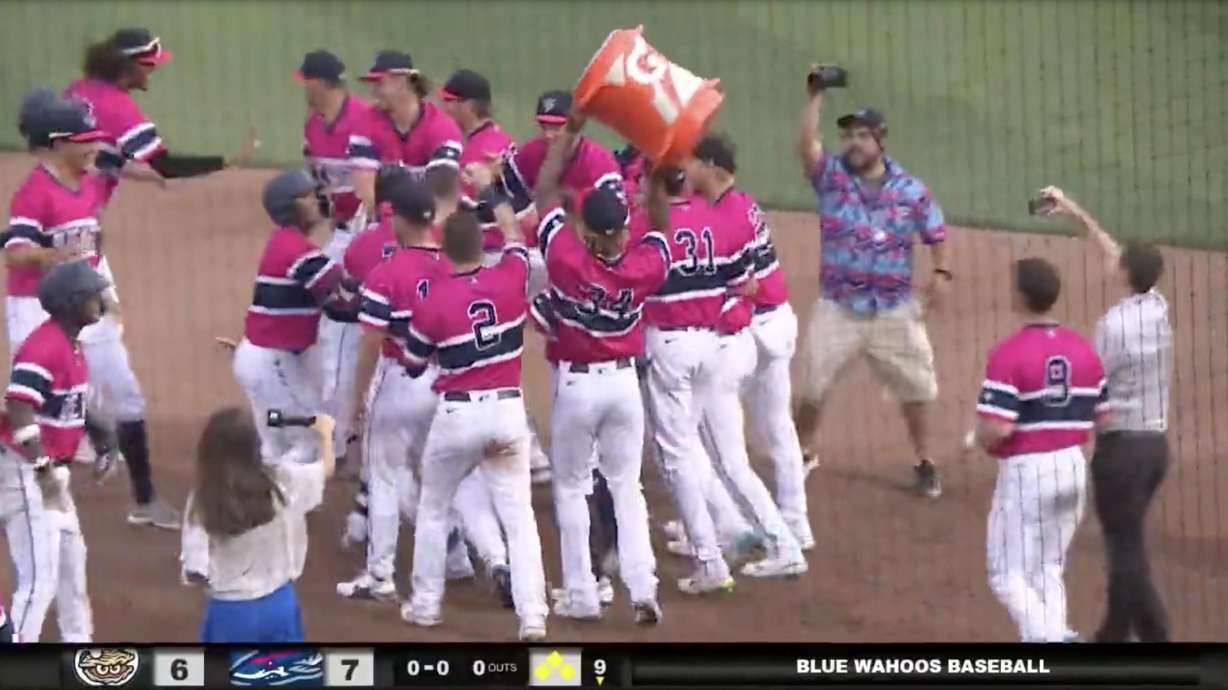 The AA Pensacola Blue Wahoos celebrate a walk-off win after four consecutive hit-by-pitches.