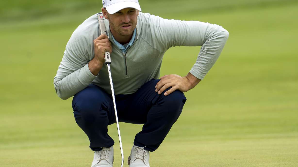 Wyndham Clark lines up his putt on the eighth green during the first round of the Canadian Open golf tournament in Toronto on Thursday, June 9, 2022.