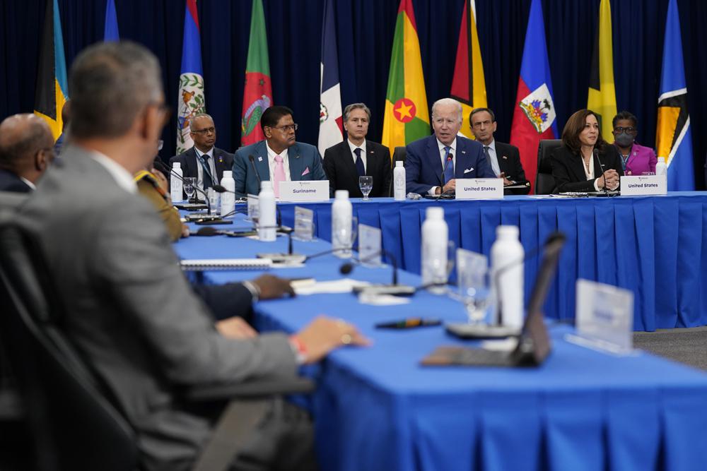 President Joe Biden, center right, speaks during a meeting with leaders of Caribbean nations beside Vice President Kamala Harris, right, and Suriname President Chandrikapersad Santokhi during the Summit of the Americas, Thursday, in Los Angeles.