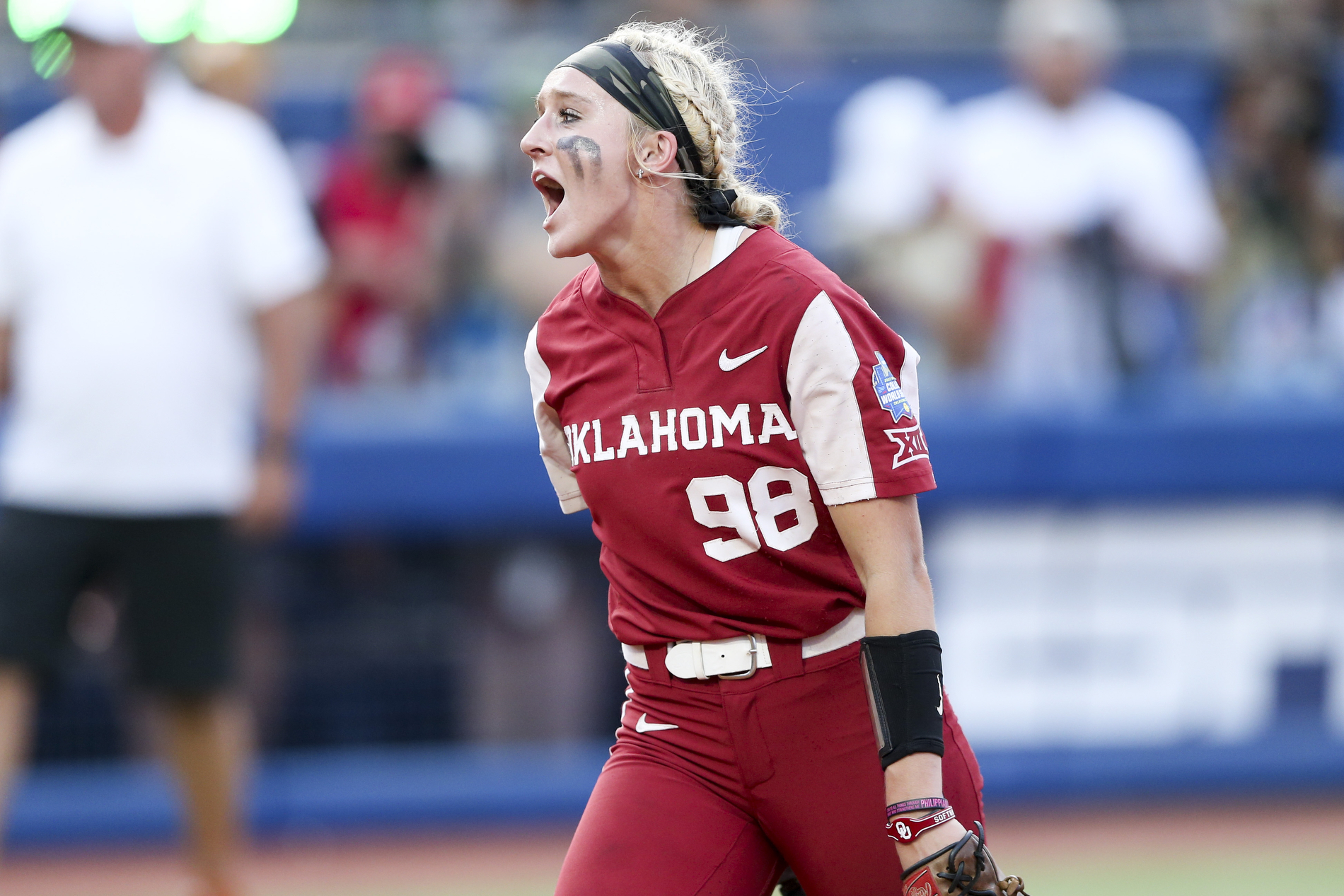 Oklahoma pitcher Jordyn Bahl (98) yells after striking out a Texas batter to end an inning during the second game of the NCAA softball Women's College World Series finals in Oklahoma City, Okla., Thursday, June 9, 2022. 