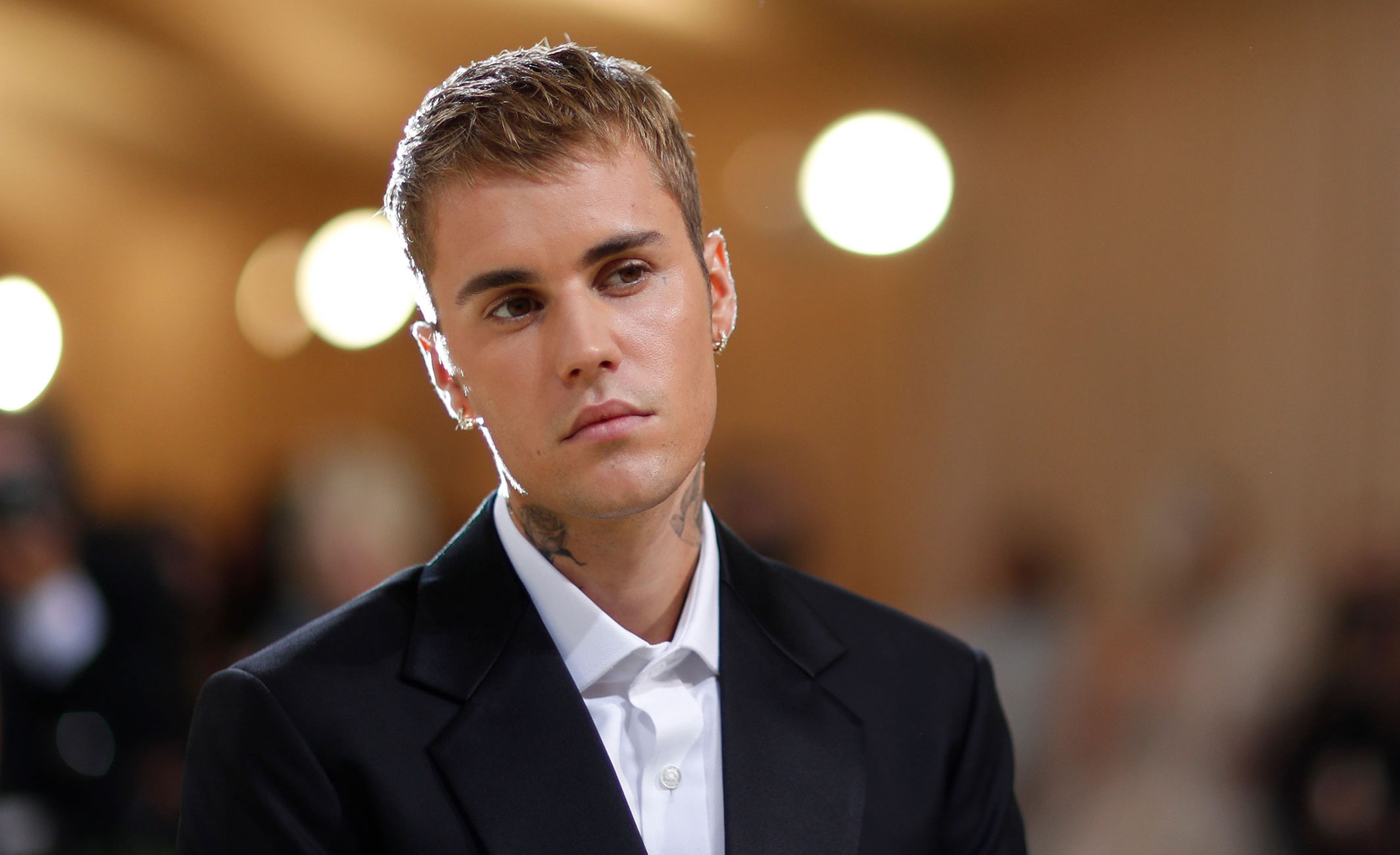 Justin Bieber at the Met Gala in New York City in September 2021. Bieber announced Friday that he is taking a break from performing because he is suffering from paralysis on one side of his face.