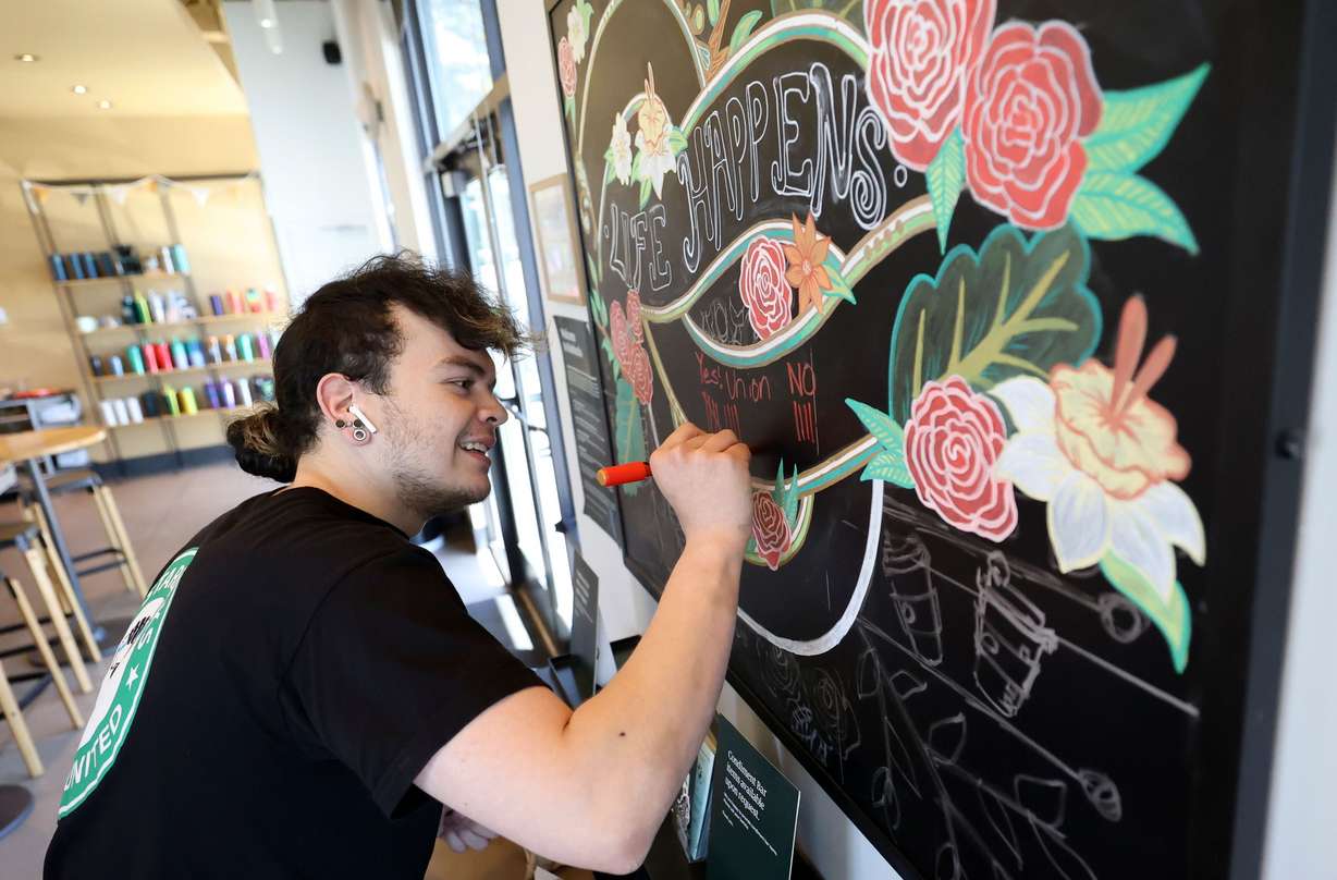 Starbucks shift leader Jacob Lawson marks votes in favor of or against unionizing as they are tallied by the National Labor Relations Board over a Zoom meeting at a Starbucks in Cottonwood Heights on Friday. The majority of staff voted in favor of unionizing, with a final tally of 11 yes votes and six no votes.