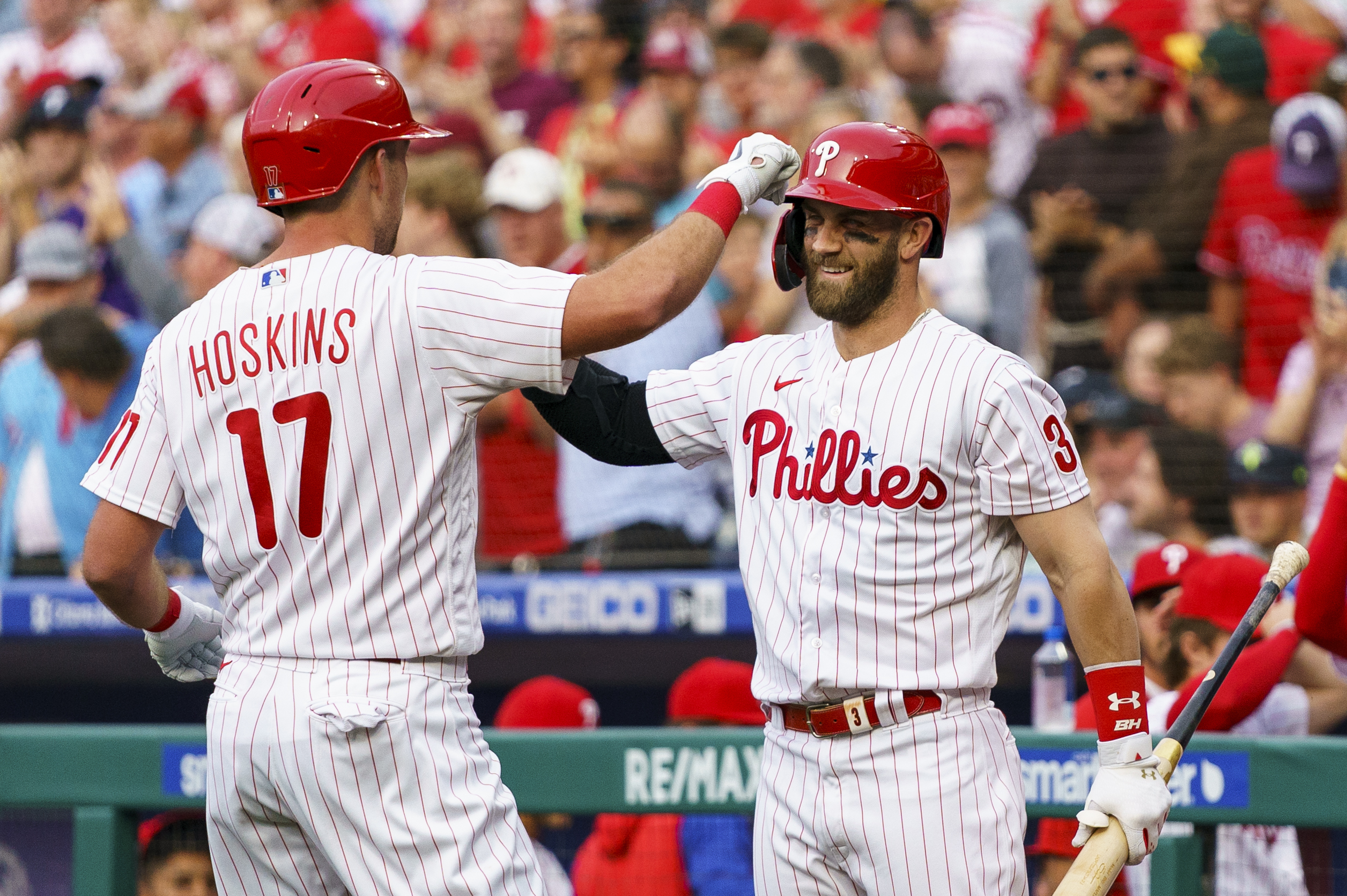 Philadelphia Phillies' Rhys Hoskins, left, celebrates his home run with Bryce Harper, right, during the first inning of a baseball game against the Arizona Diamondbacks, Friday, June 10, 2022, in Philadelphia. 