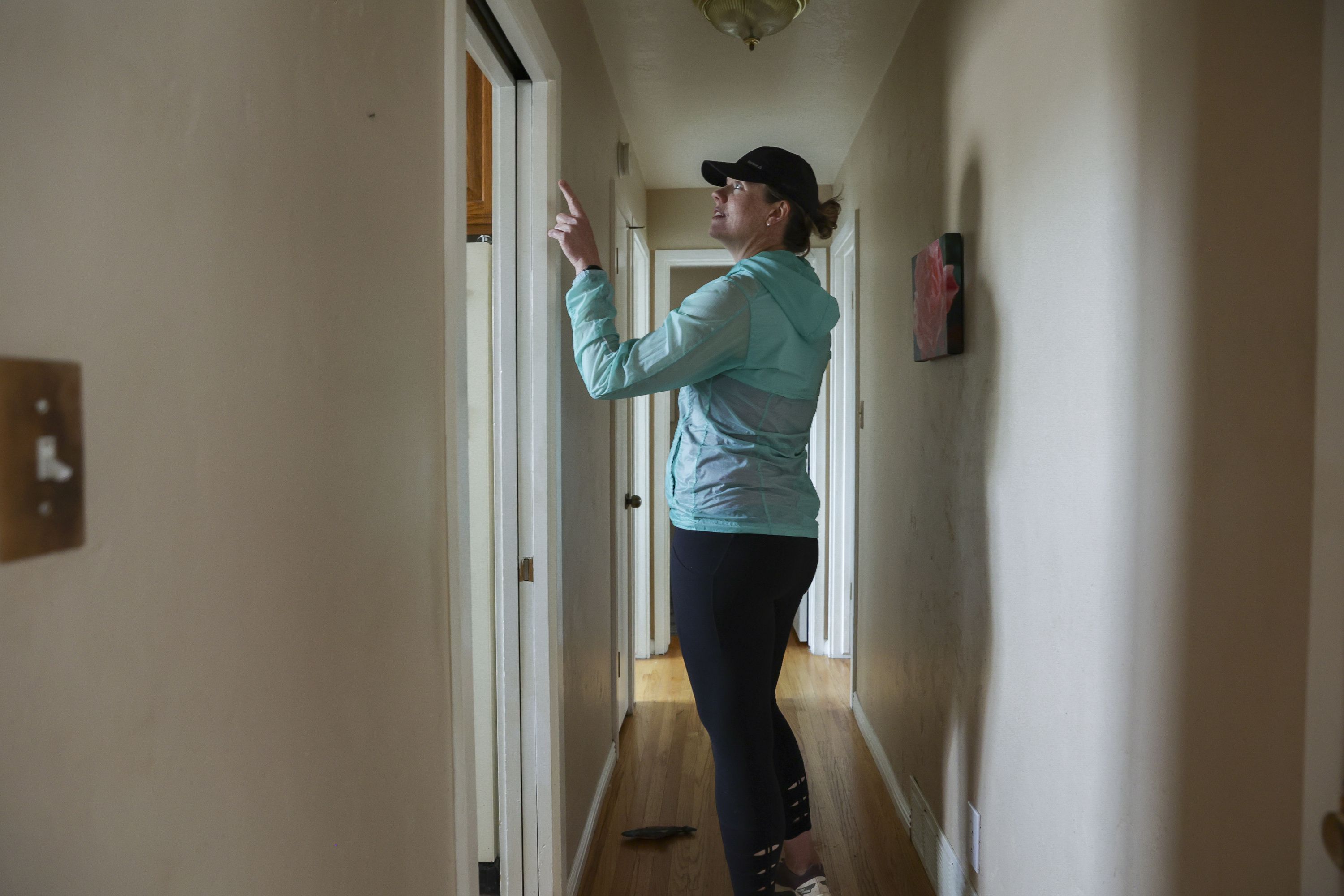 Lara Gale points to repairs in the kitchen of the house she recently bought in Ogden on May 12. As the price of housing shoots higher and higher into the clouds with no clear end in sight, millennials — and yes, Gen Z — are finding it nearly impossible to afford a home.