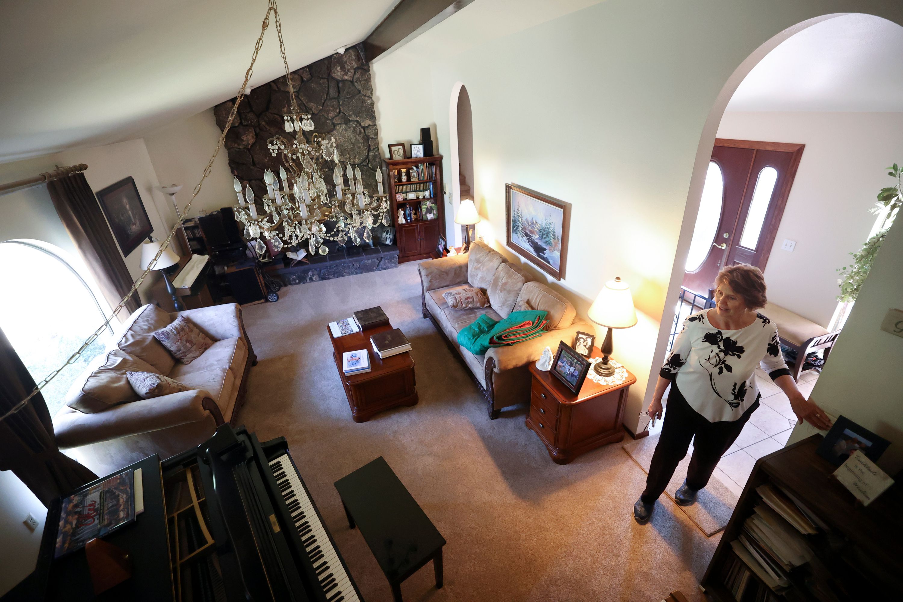 Maureen Gale shows the living room of her home in Sandy on May 18. As the price of housing shoots higher and higher into the clouds with no clear end in sight, millennials — and yes, Gen Z — are finding it nearly impossible to afford a home.