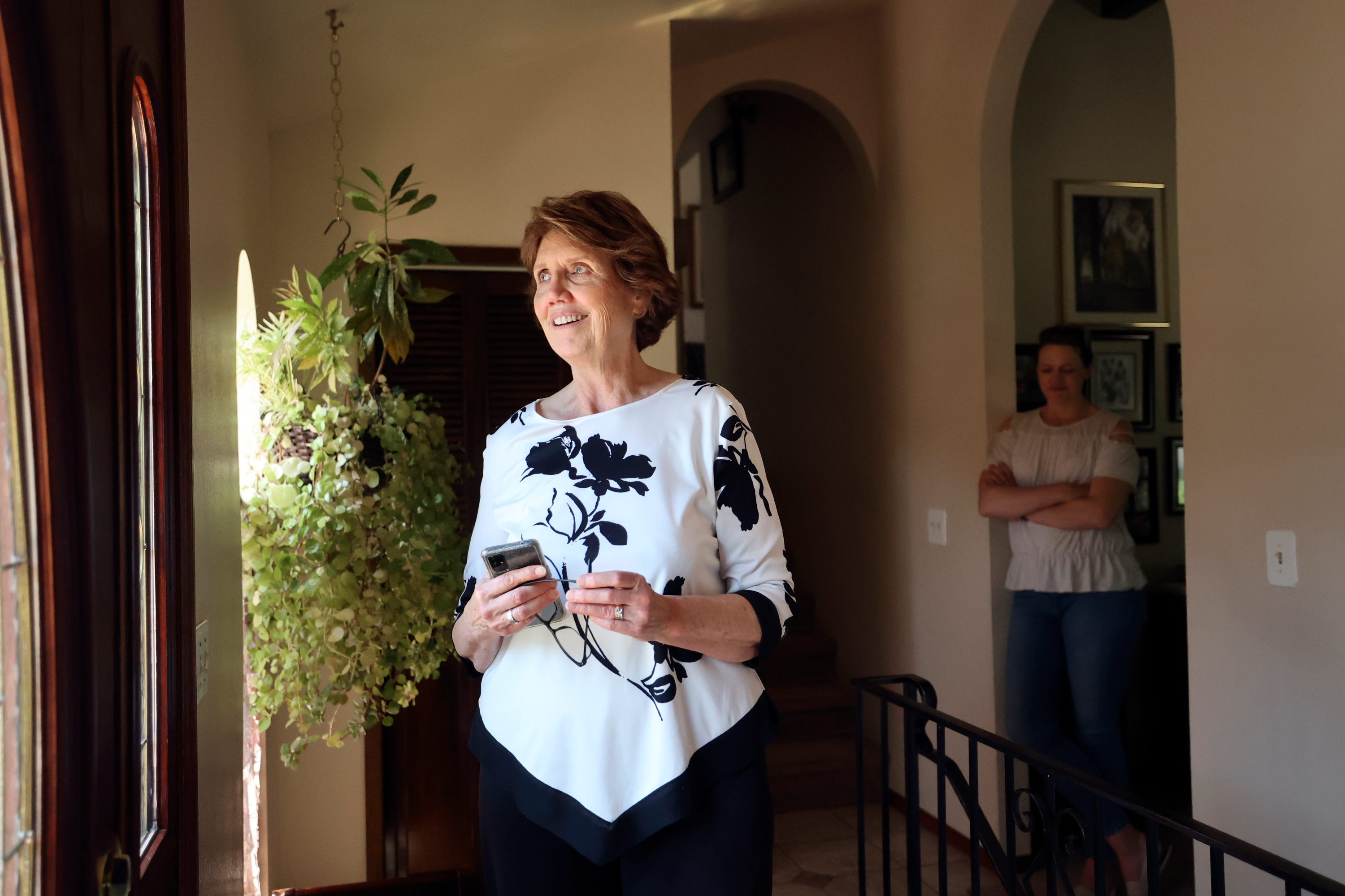 Maureen Gale talks about the features of her home in Sandy on May 18 as daughter Lara Gale looks on. As the price of housing shoots higher and higher into the clouds with no clear end in sight, millennials — and yes, Gen Z — are finding it nearly impossible to afford a home.
