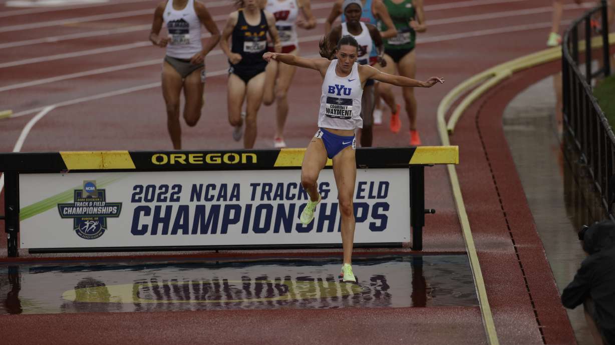 BYU distance runner Courtney Wayment leaps over the barrier while winning the 3,000-meter steeplechase national title by six seconds, Saturday, June 11, 2022 in Eugene, Oregon.