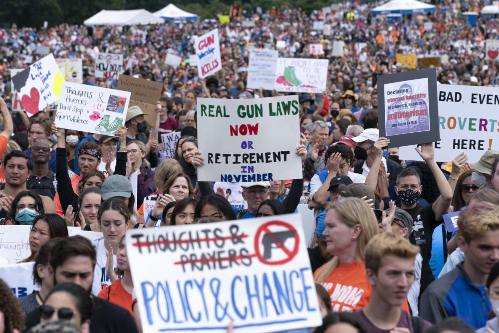 People participate in the second March for Our Lives rally in support of gun control Saturday in Washington. The rally is a successor to the 2018 march organized by student protestors after the mass shooting at a high school in Parkland, Fla.