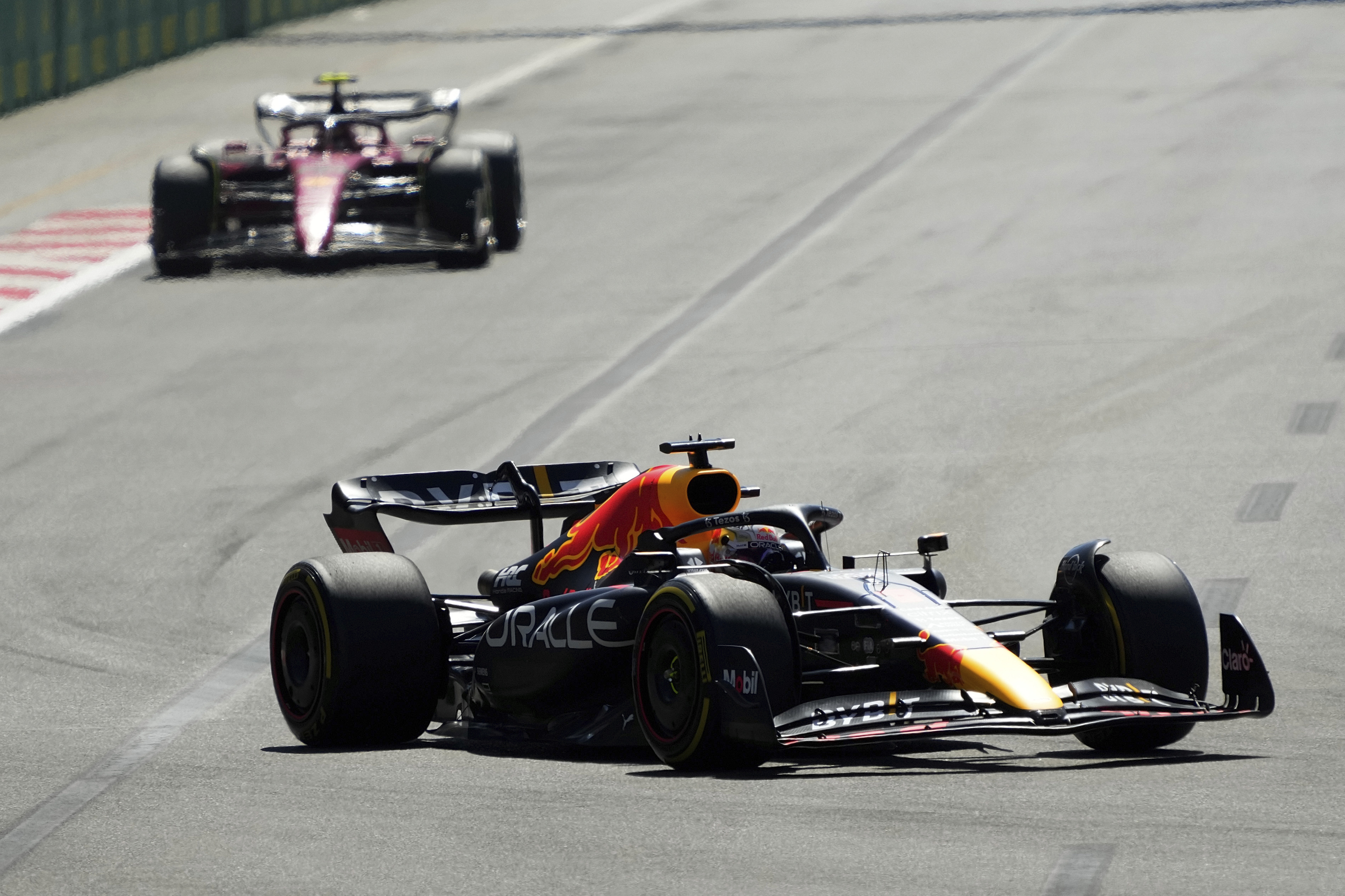 Red Bull driver Max Verstappen of the Netherlands leads Ferrari driver Carlos Sainz of Spain during the Azerbaijan Formula One Grand Prix at the Baku circuit, in Baku, Azerbaijan, Sunday, June 12, 2022. 