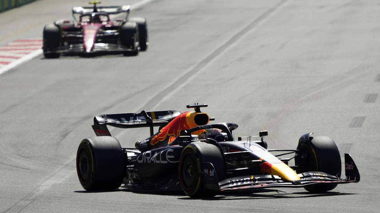 Red Bull driver Max Verstappen of the Netherlands leads Ferrari driver Carlos Sainz of Spain during the Azerbaijan Formula One Grand Prix at the Baku circuit, in Baku, Azerbaijan, Sunday, June 12, 2022.