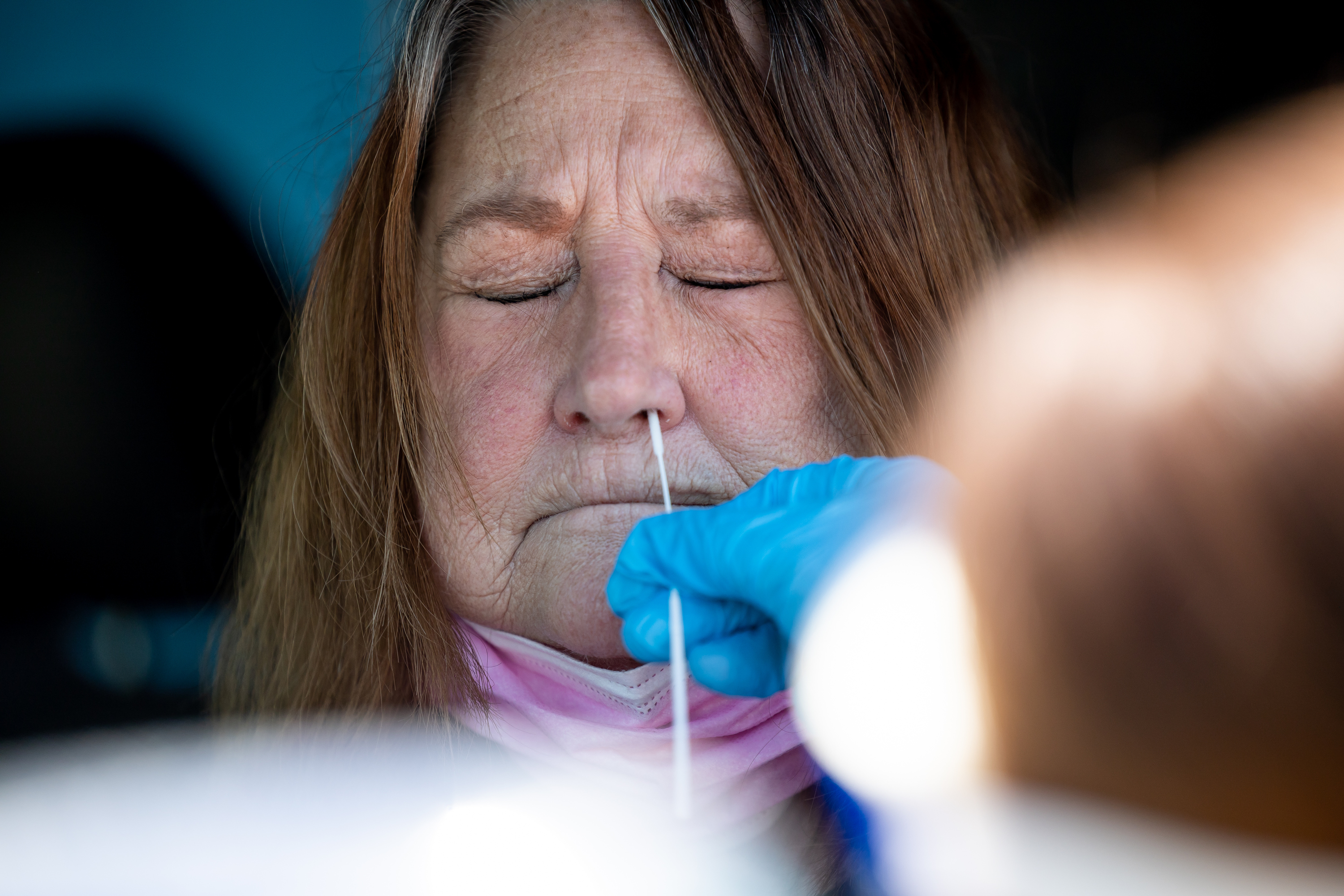 Pam Anderson gets tested for COVID-19 at a NOMI Health drive-thru test site in West Valley City on Friday. Nine of Utah's 29 counties have reached the medium community level for COVID-19, up from just three a week ago.