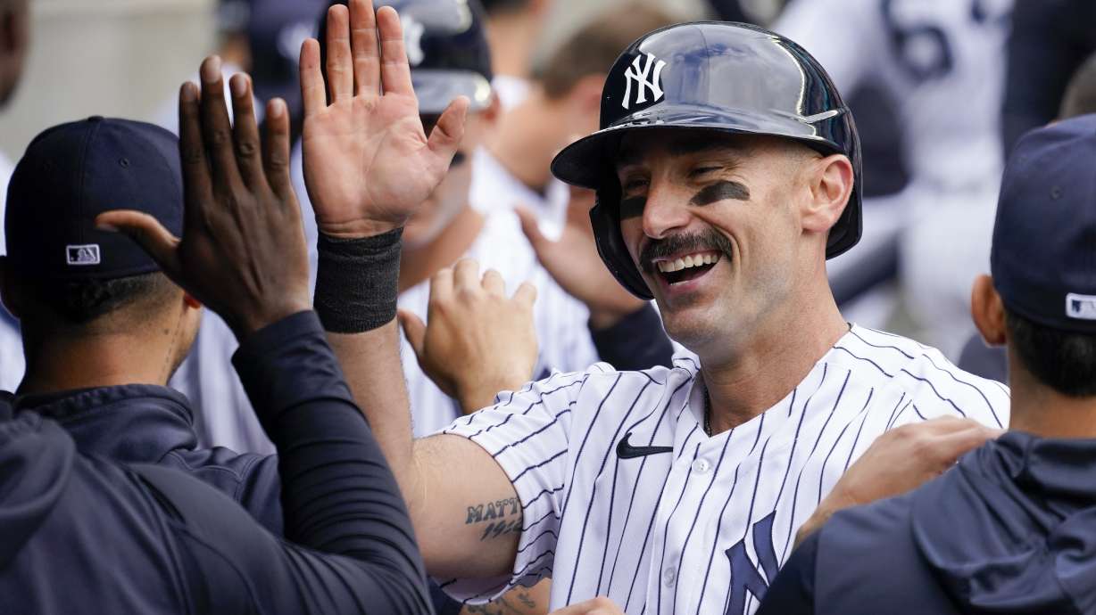 New York Yankees' Matt Carpenter celebrates after hitting a two-run home run in the sixth inning of a baseball game against the Chicago Cubs, Sunday, June 12, 2022, in New York.