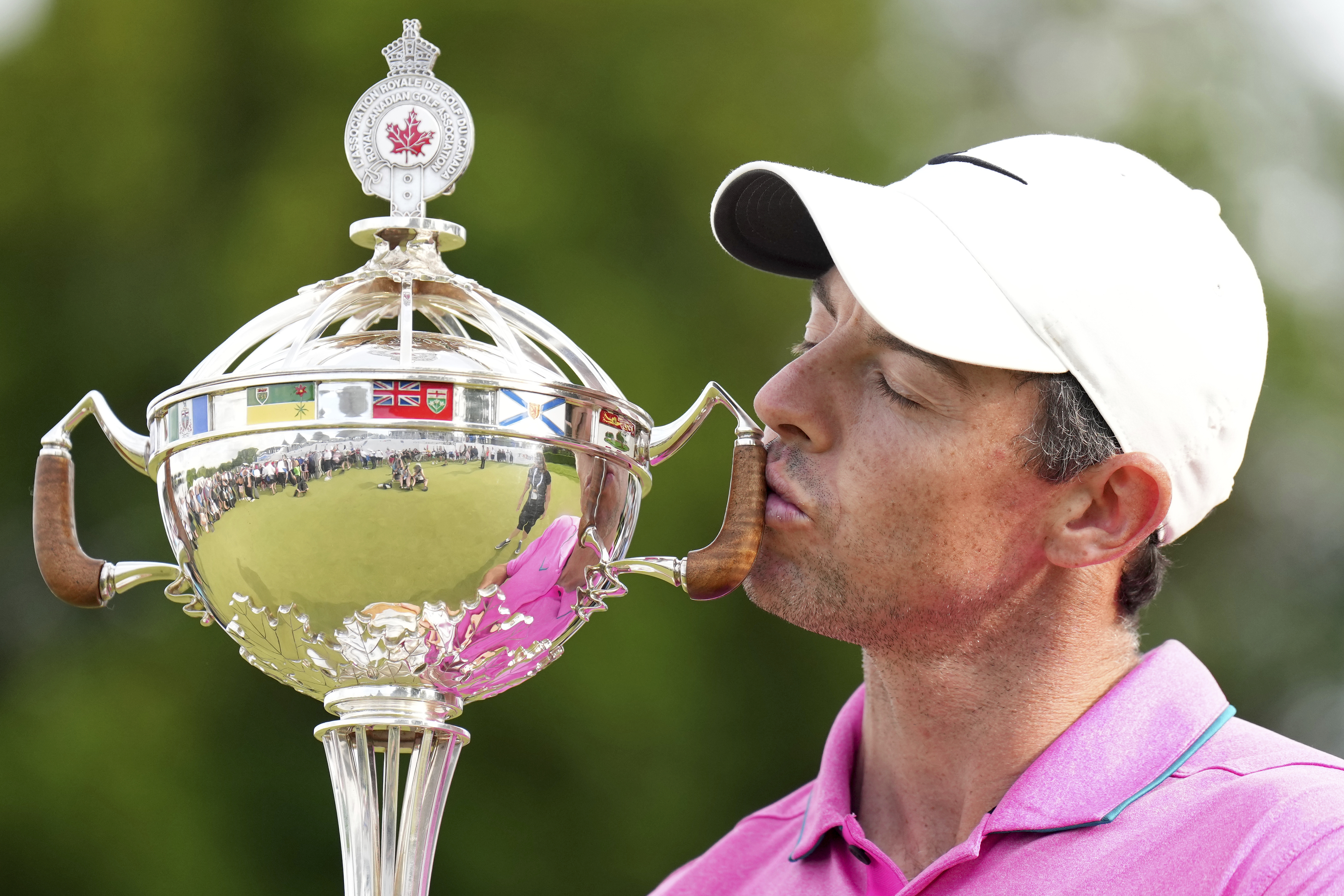 Rory McIlroy, of Northern Ireland, kisses the trophy after winning the final round of the Canadian Open golf tournament at St. George's Golf and Country Club in Toronto,  Sunday, June 12, 2022. 
