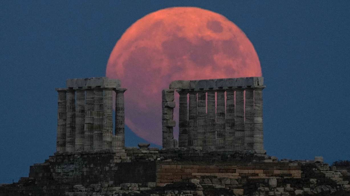 A strawberry full moon, shown here in Cape Sounion, Greece, on June 2021, will appear from June 12 moonrise to June 15 moonset, according to NASA.