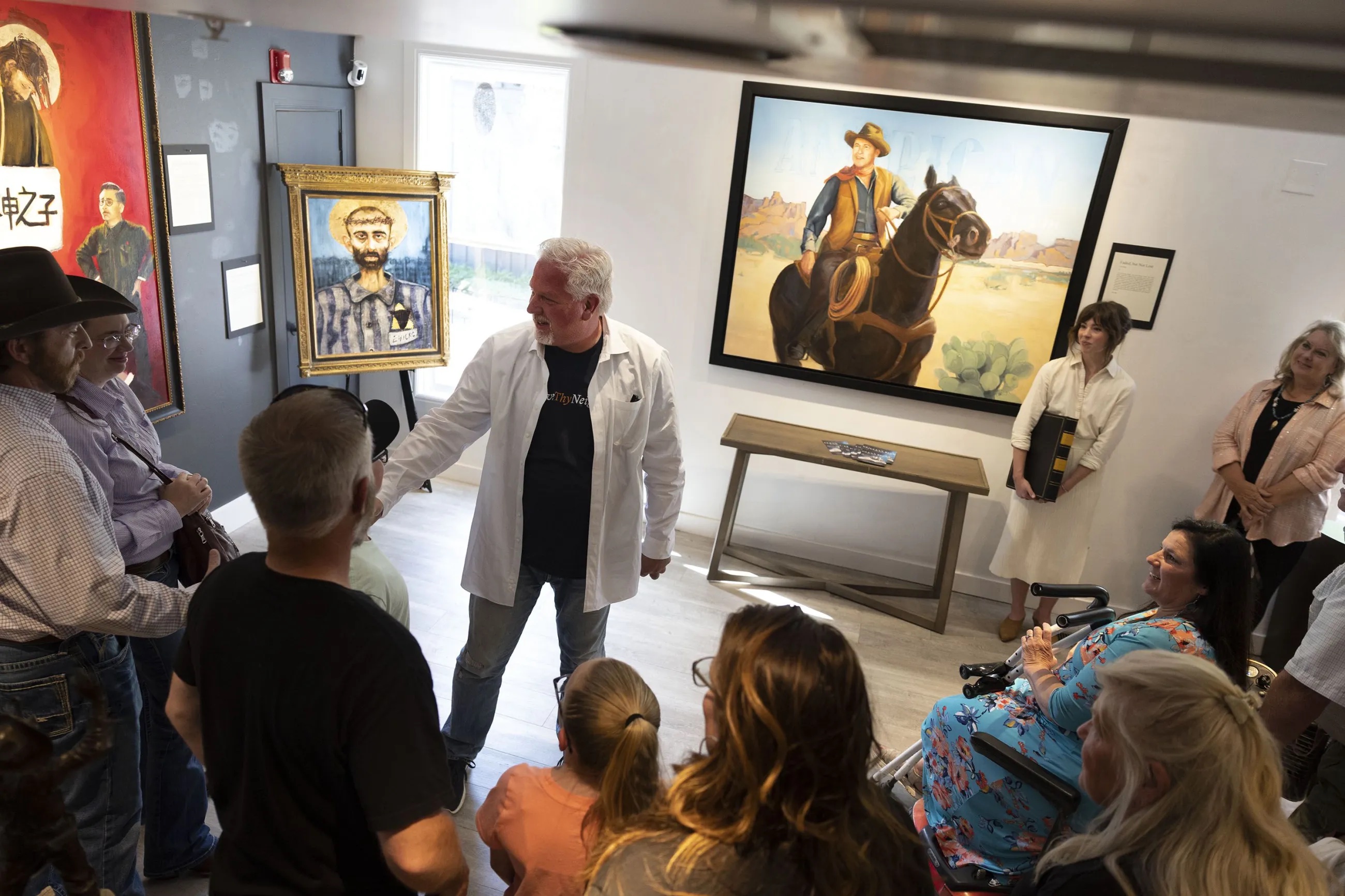 Gallery opening attendees listen to Glenn Beck talk about his work at Park City Fine Art on Friday, June 10, 2022.