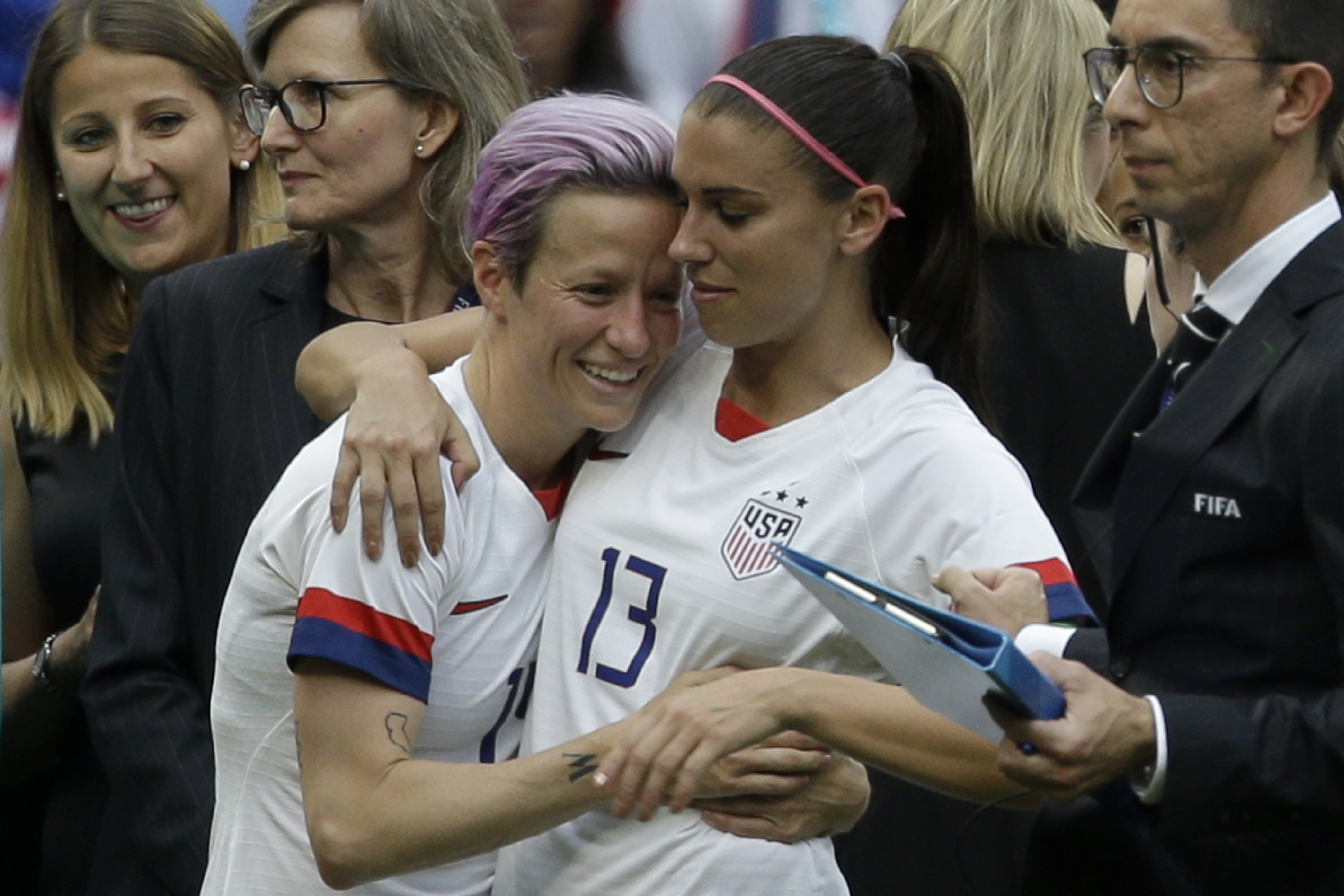FILE - United States' Megan Rapinoe, left, and Alex Morgan celebrate after winning the Women's World Cup final soccer match between U.S. and The Netherlands at the Stade de Lyon in Decines, outside Lyon, France, Sunday, July 7, 2019. Rapinoe and Morgan were included on the U.S. national team roster for the upcoming CONCACAF W Championship, which will determine four of the region’s teams in the 2023 Women’s World Cup. 