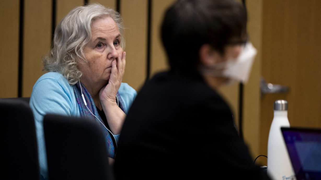Romance writer Nancy Crampton Brophy, left, accused of killing her husband, Dan Brophy, in June 2018, watches proceedings in court in Portland, Ore., on April 4. She was sentenced Monday to life in prison with the possibility of parole for murdering her husband.