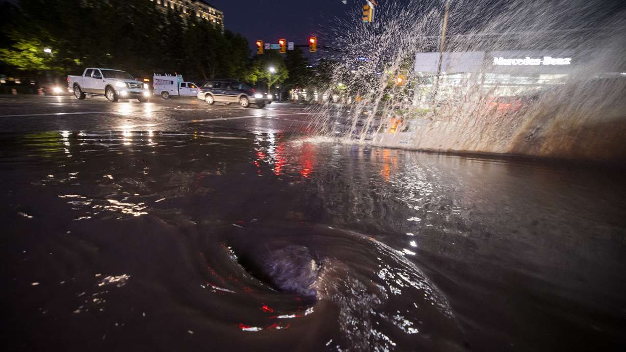 Water swirls down a storm drain at 600 South and State Street after heavy rain hit northern Utah on Aug. 1, 2021. Salt Lake City Department of Public Utilities opened a new "Adopt a Storm Drain" program to help clean up residential drains last week.