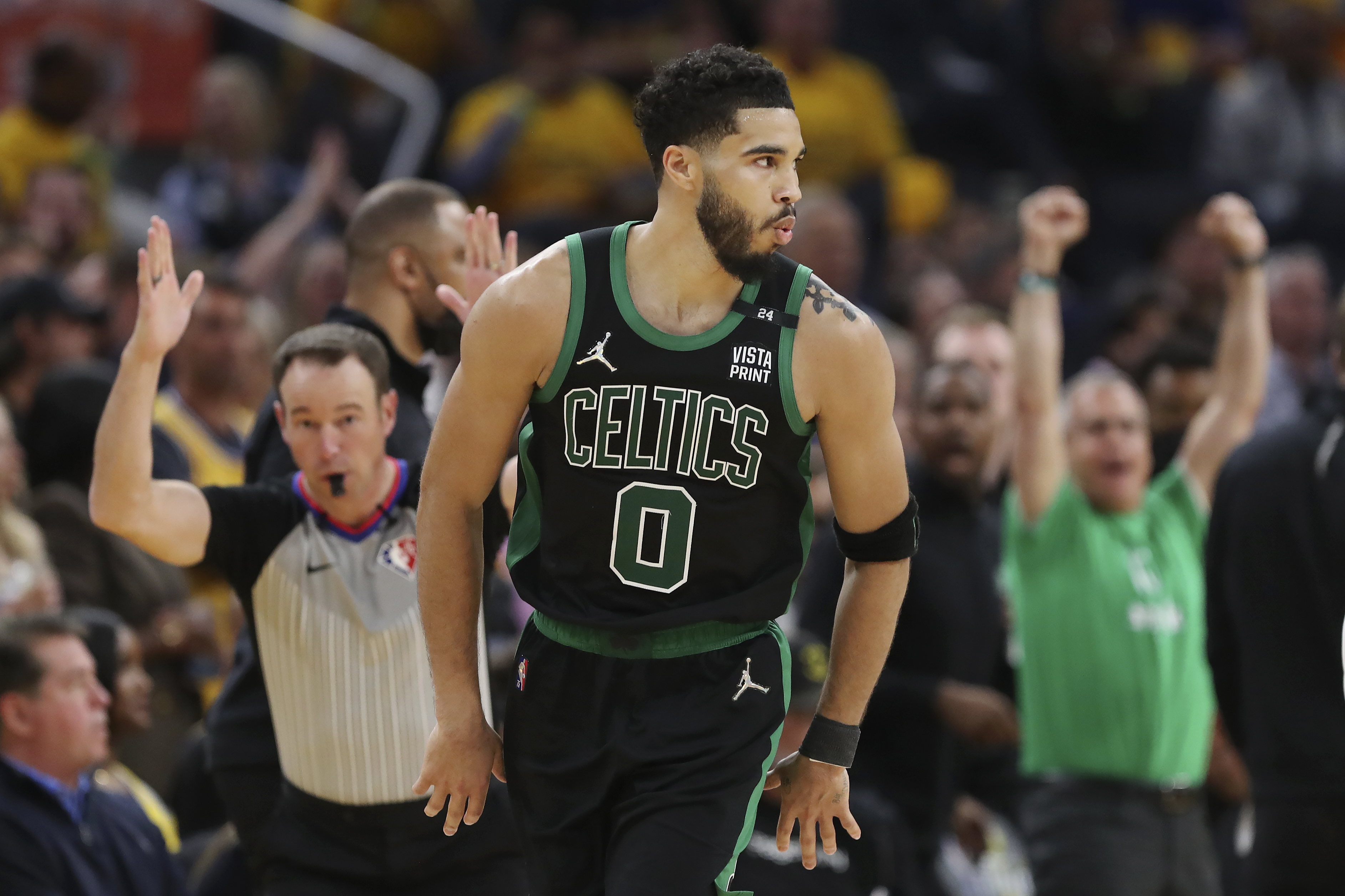 Boston Celtics forward Jayson Tatum (0) reacts after scoring against the Golden State Warriors during the second half of Game 5 of basketball's NBA Finals in San Francisco, Monday, June 13, 2022. 