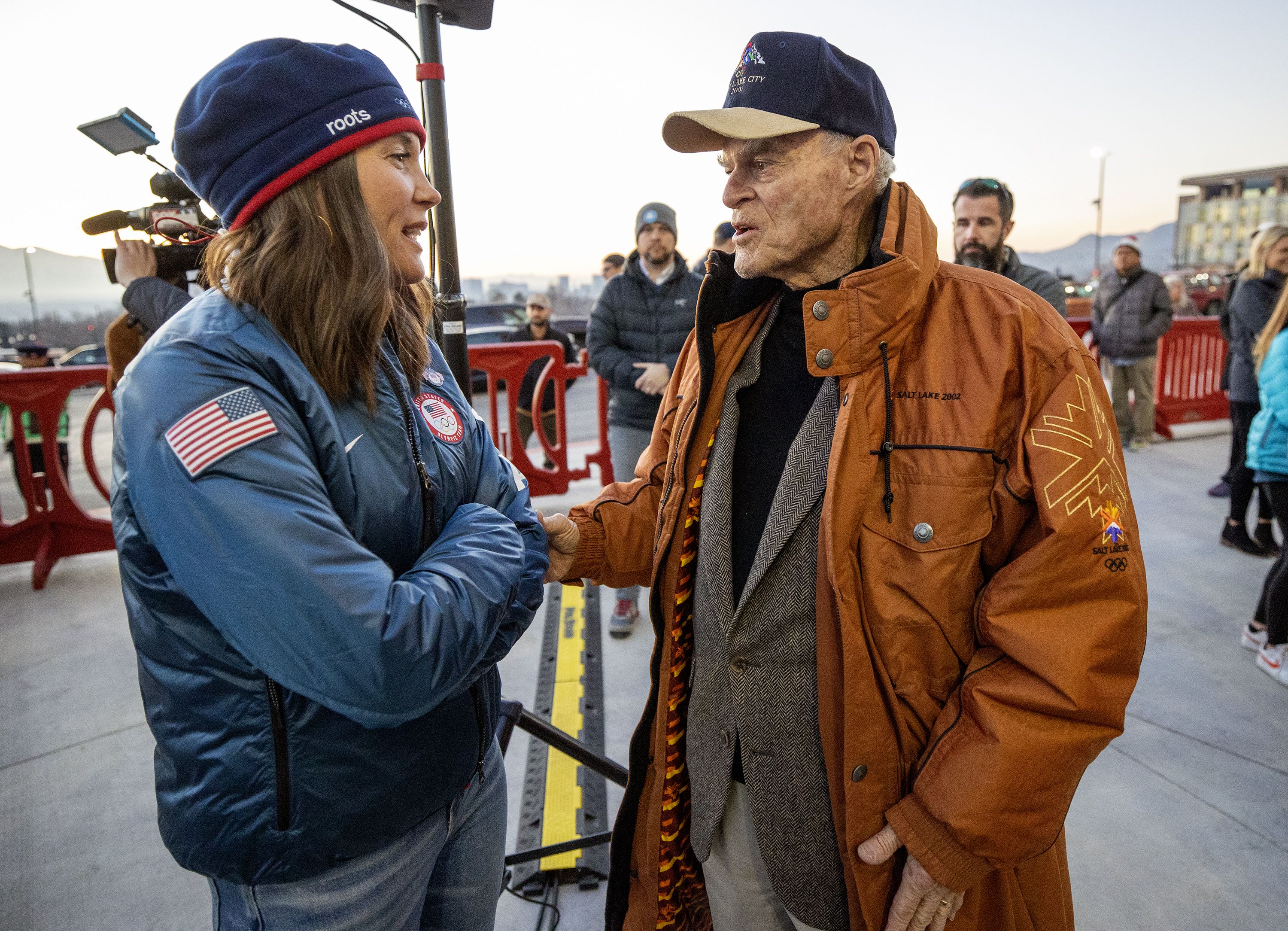 Salt Lake City Mayor Erin Mendenhall and Spence Eccles talk as they join hundreds gathered at Rice-Eccles Stadium at the University of Utah on Tuesday, Feb. 8, to watch the Olympic Cauldron be lit, marking the 20-year anniversary of the Salt Lake 2002 Olympics opening ceremony.